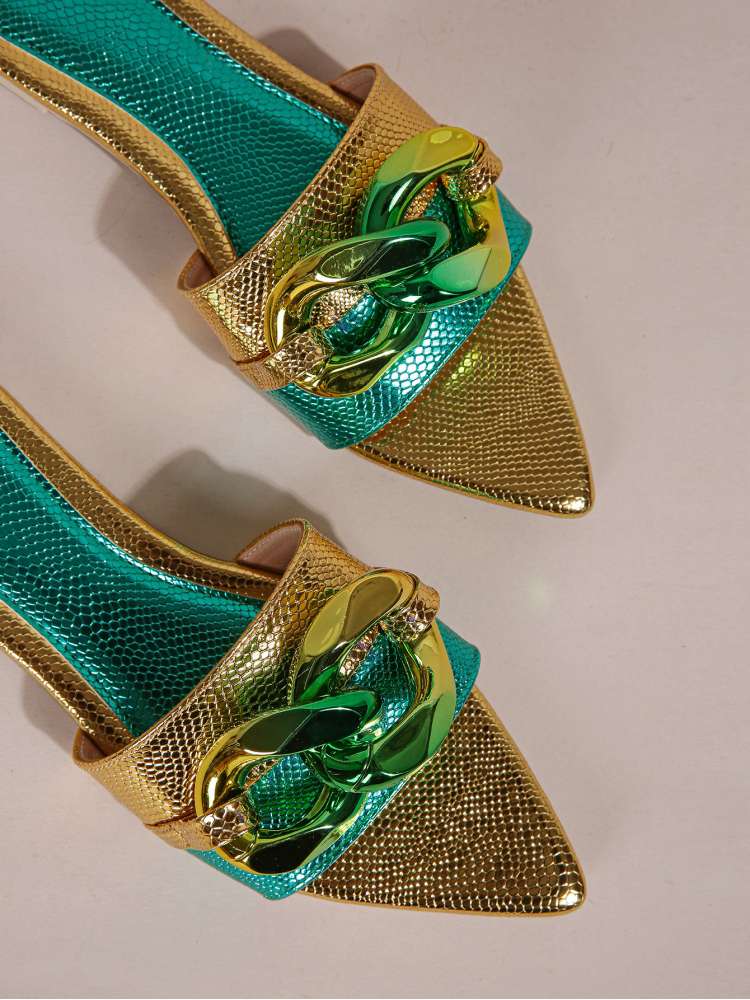 Wholesale7 acrylic pointed toe slippers in gold and green with textured finish and decorative chain detail