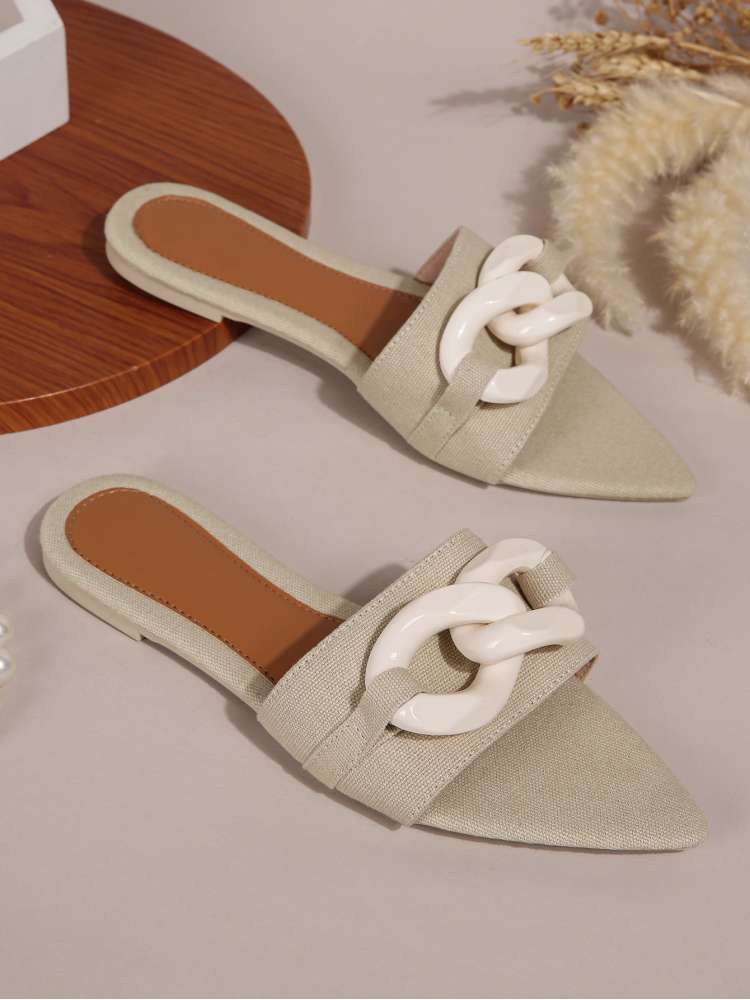 Wholesale7 acrylic pointed toe slippers in beige with large white chain decoration and open back design