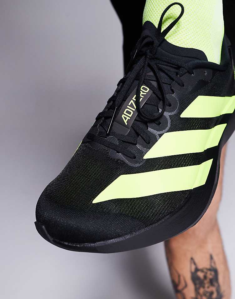 Black and neon adidas Adizero Evo SL sneakers for men with breathable mesh and lace-up design
