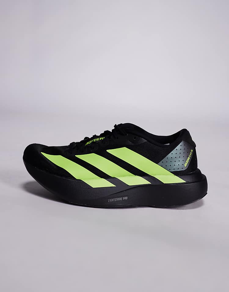 Black and neon green adidas Adizero Evo SL sneakers with lightweight design and cushioned sole