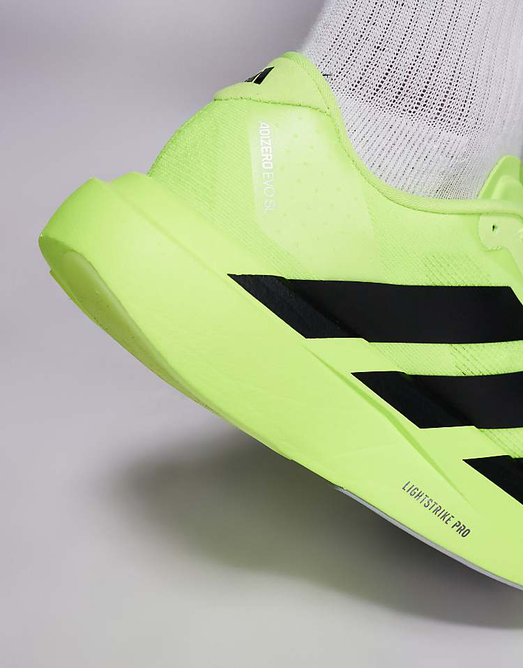 Bright green adidas Adizero Evo SL sneakers with black stripes and Lightstrike Pro sole for men