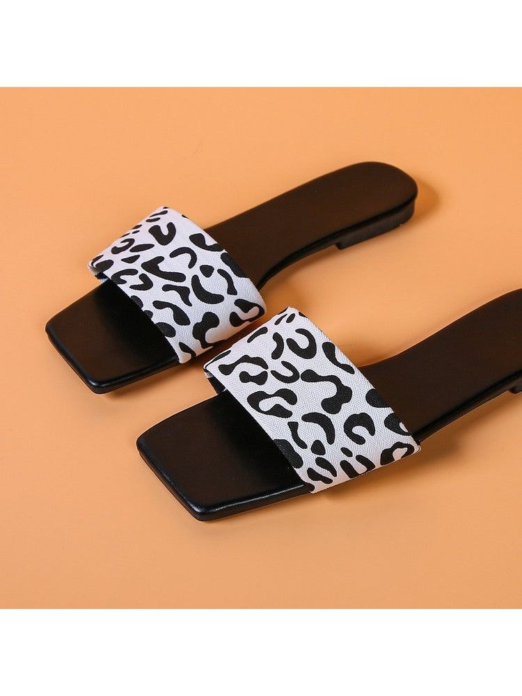 Wholesale7 animal print square toe slippers with black sole and white leopard pattern strap