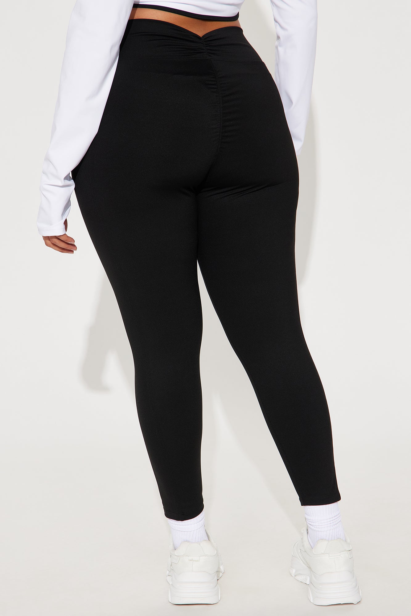 Fashion Nova black active leggings for women with a stylish ruched back design
