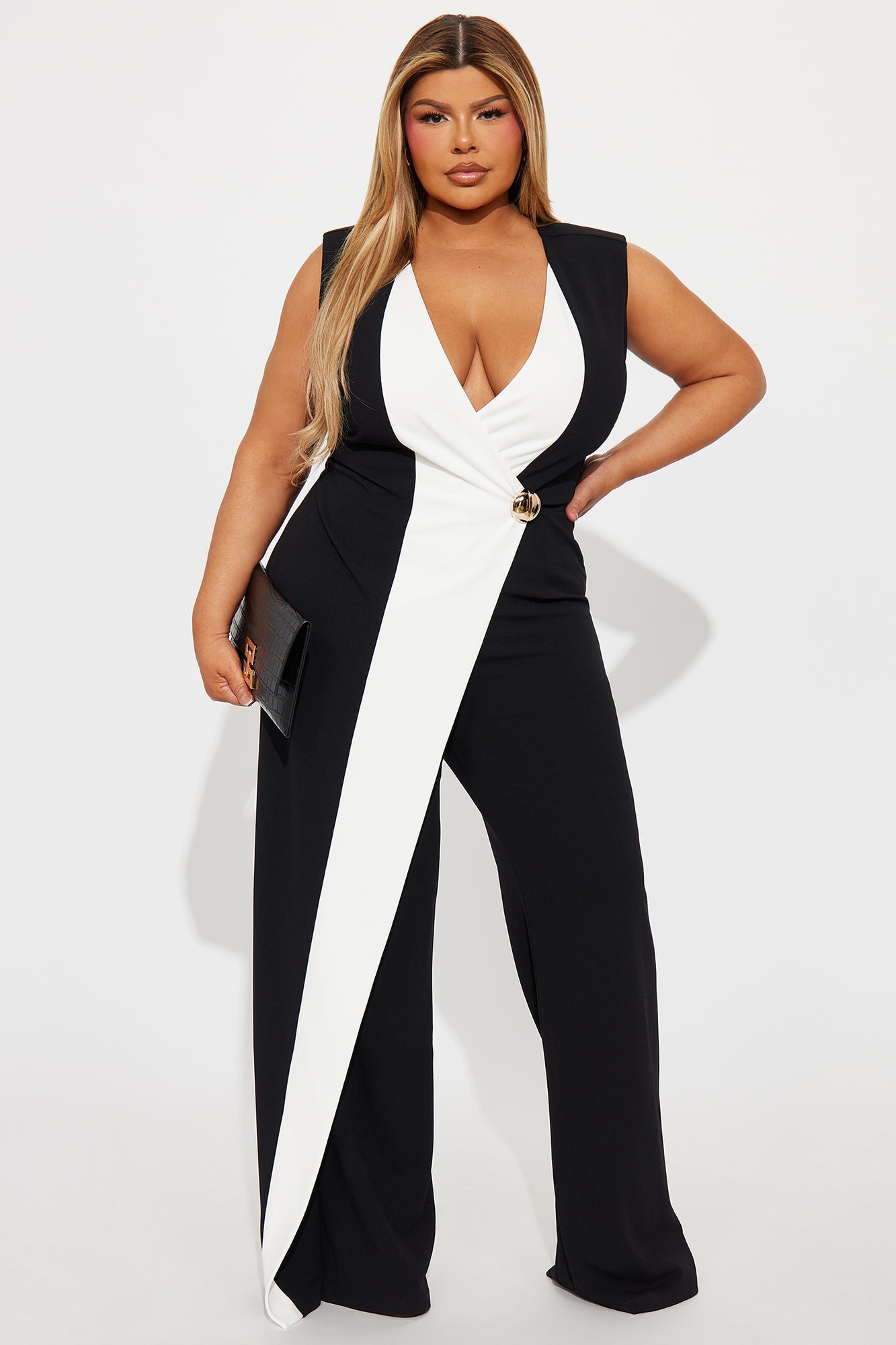 Elegant black and white crepe jumpsuit with a plunging neckline and stylish waist detail