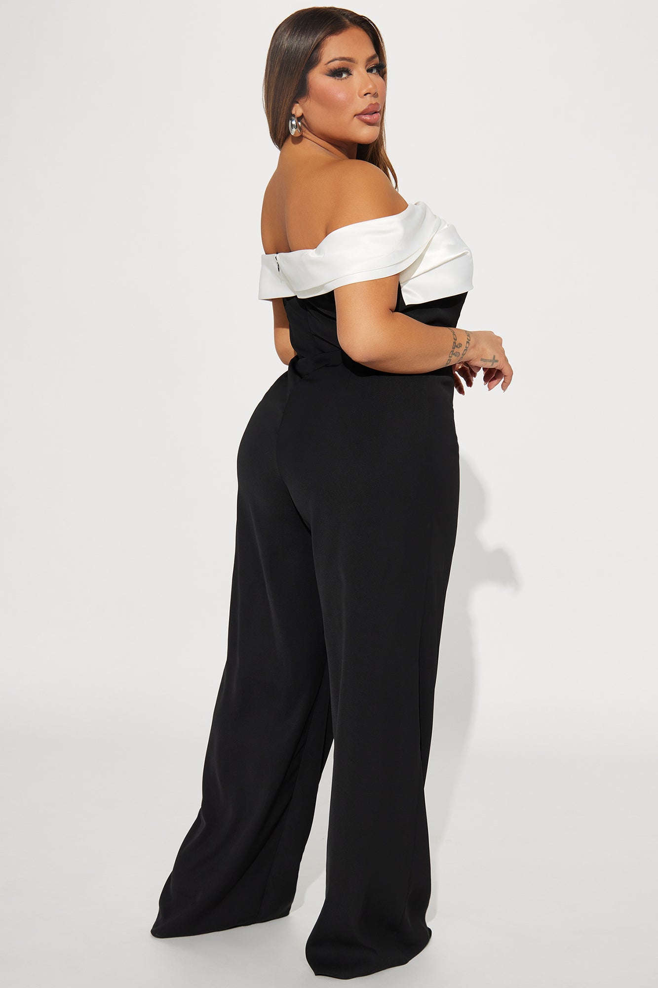 Fashion Nova black and white jumpsuit for women with off-the-shoulder design and wide-leg silhouette