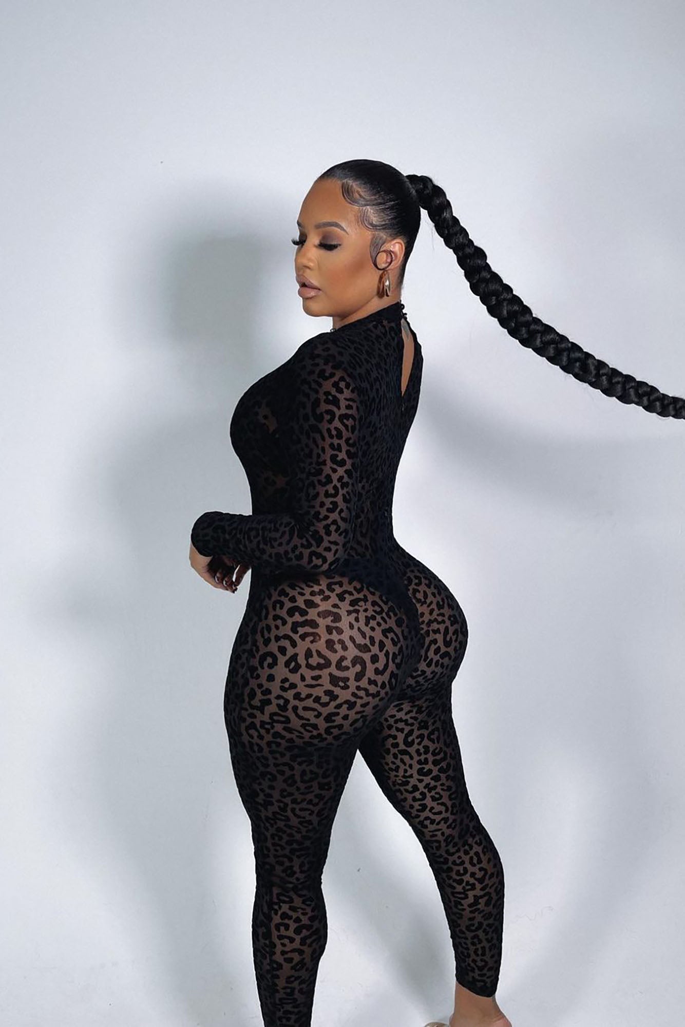 Fashion Nova black animal print mesh bodystocking showcasing a stylish design and flattering fit on a model