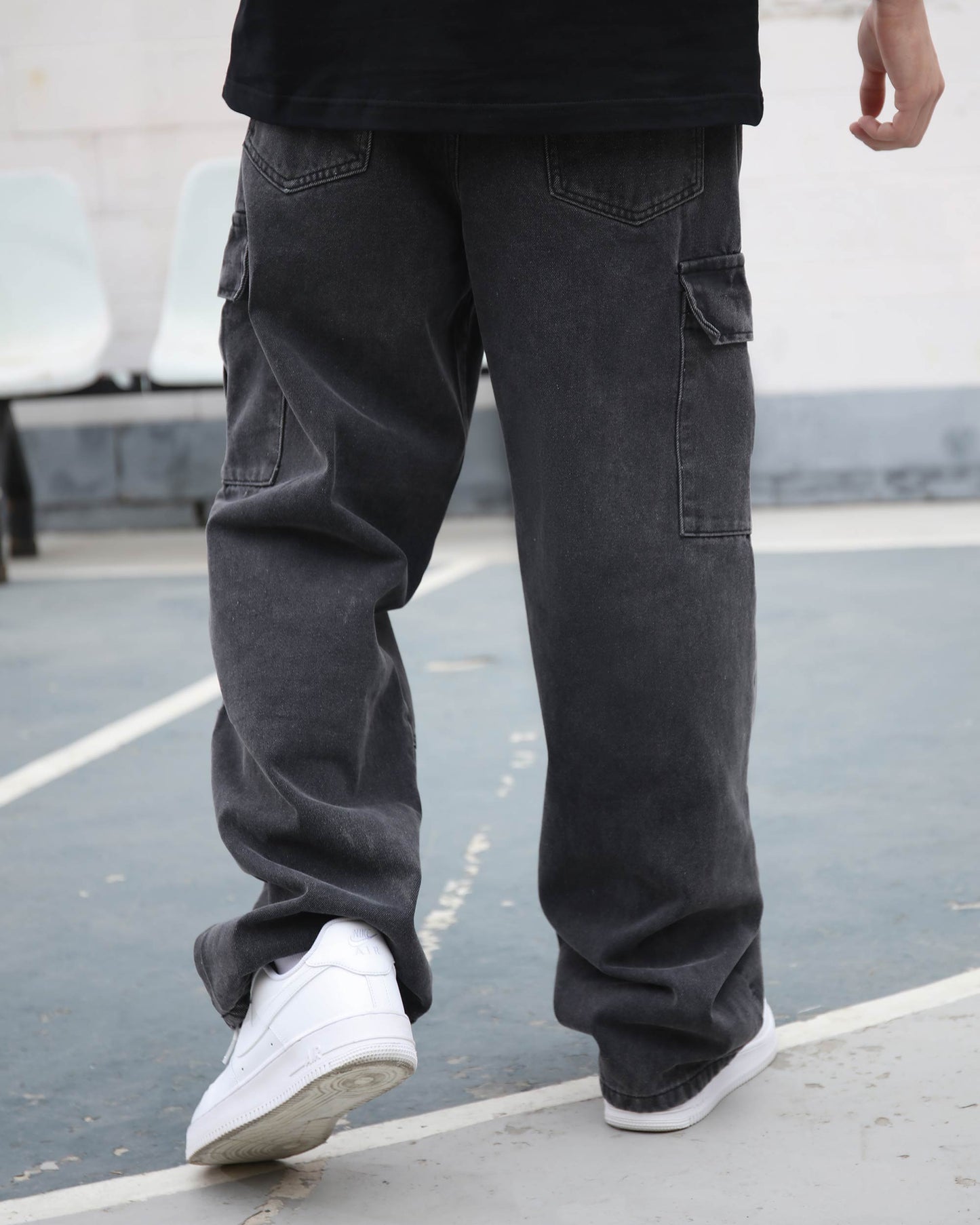 Logeqi black cargo jeans men with multiple pockets and relaxed fit styled with white sneakers