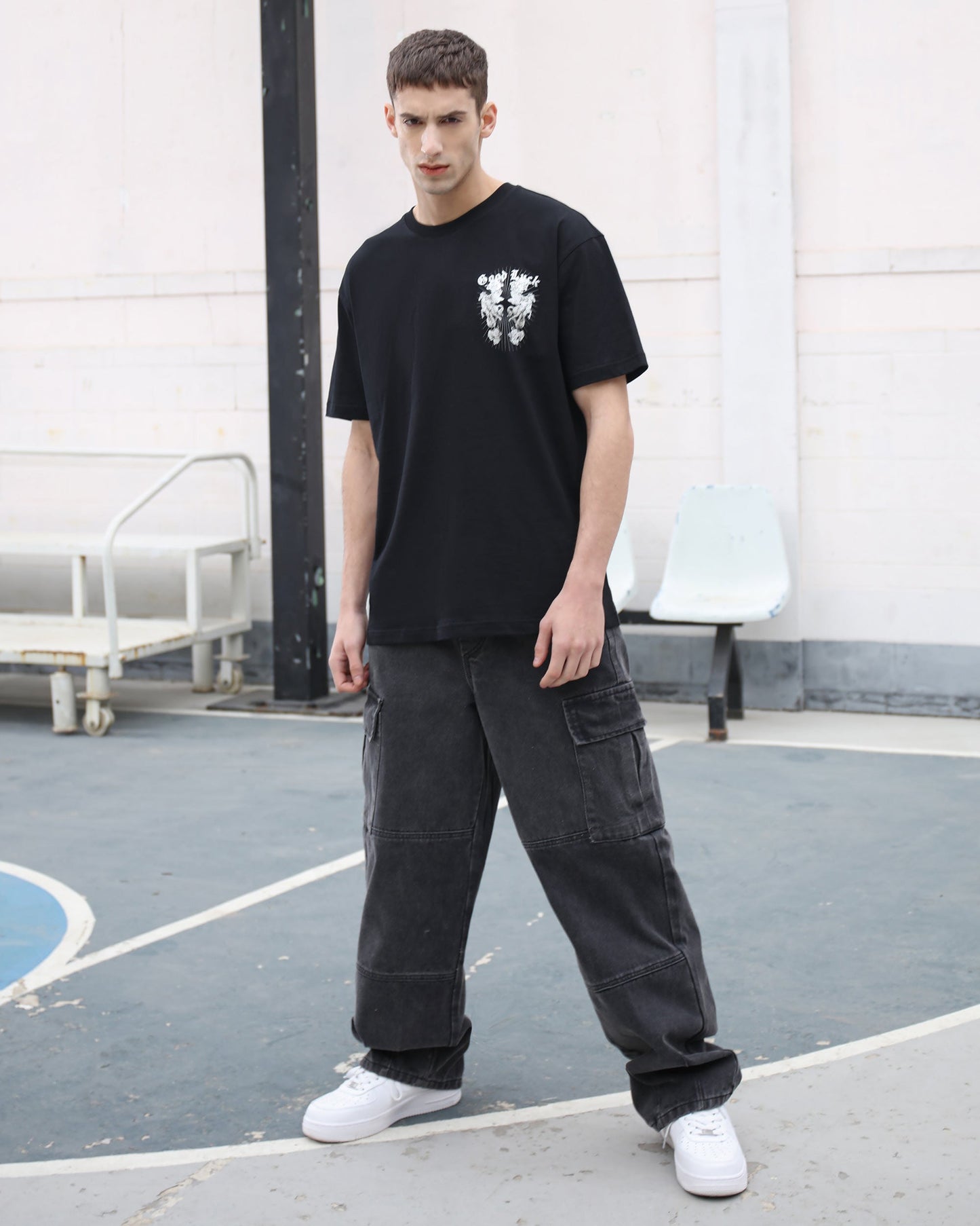 Logeqi black cargo jeans men styled with casual black graphic t-shirt and white sneakers