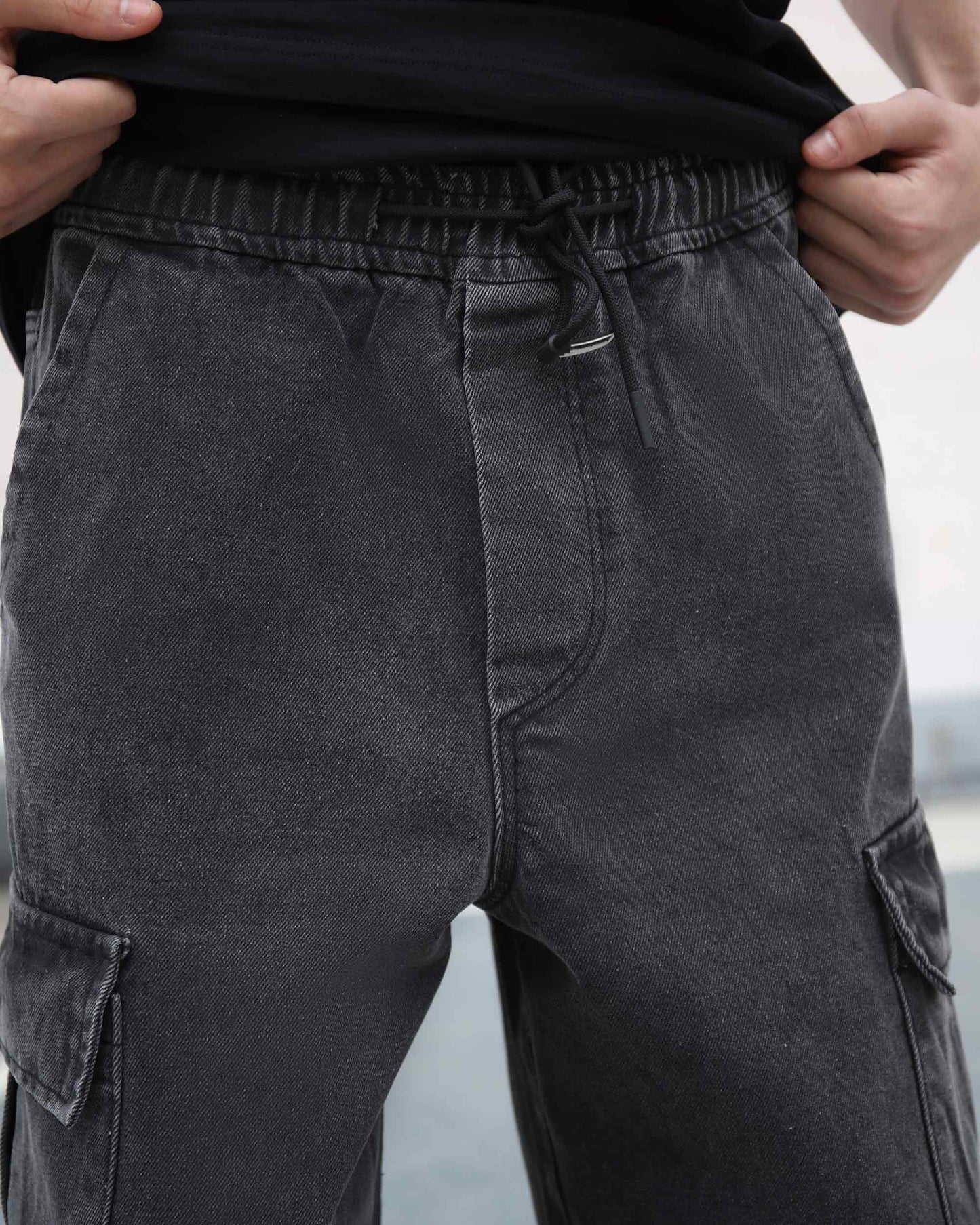 Logeqi black cargo jeans men with elastic waistband and front pockets in faded black denim