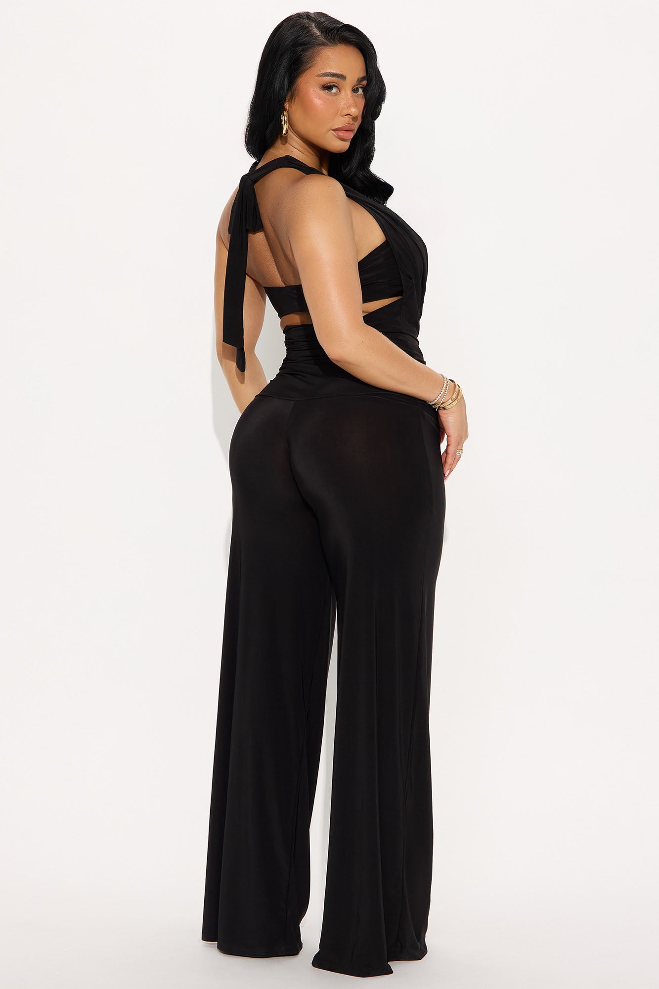 Elegant black cowl neck jumpsuit by Fashion Nova with a stylish back design and wide-leg fit