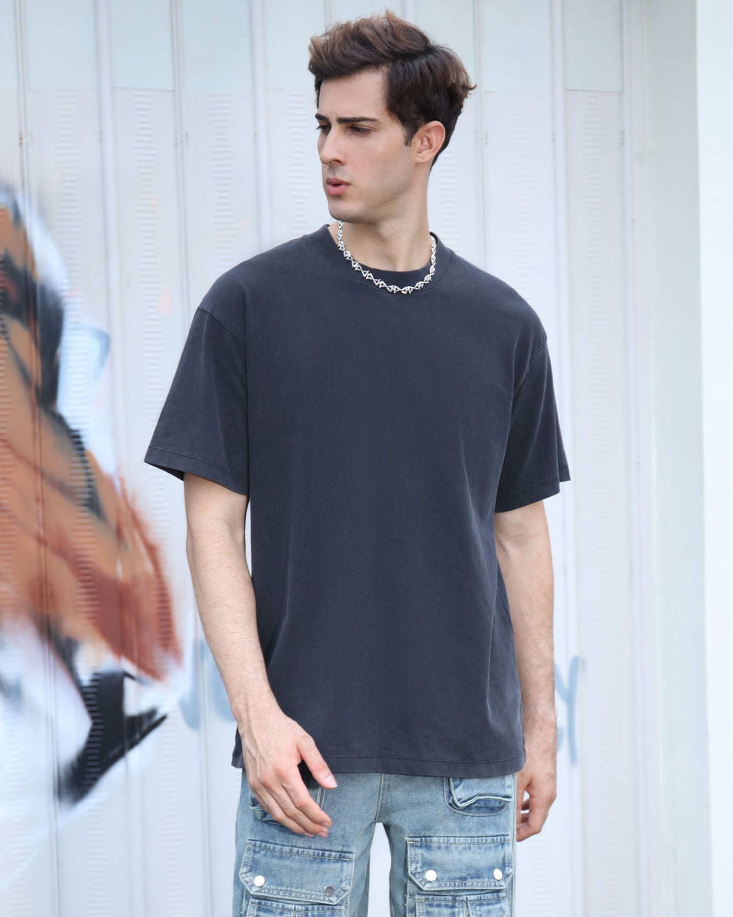 Logeqi black crew neck t-shirt displayed on a model with a relaxed fit and casual style