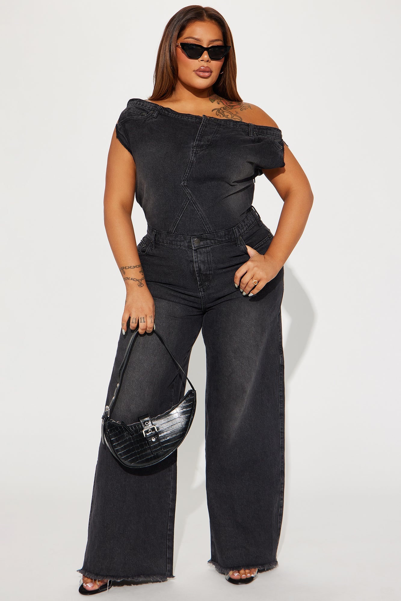 Black denim jumpsuit for women with an off-the-shoulder design and wide-leg fit from Fashion Nova