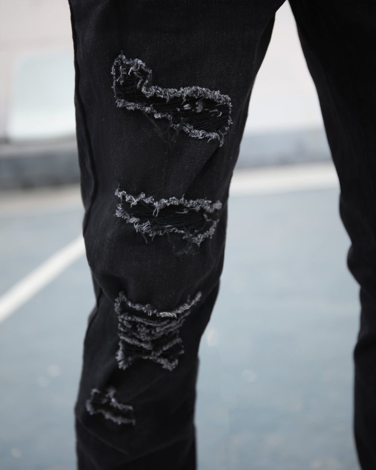 Logeqi black graffiti slim-fit jeans with distressed detailing for a trendy look
