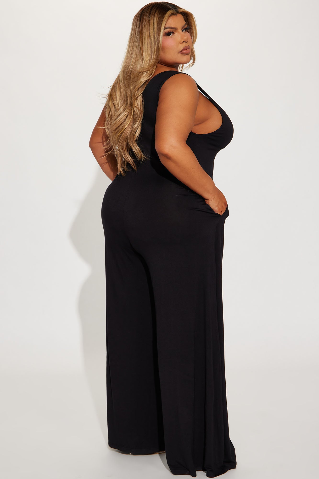 Stylish black jumpsuit for women with a relaxed fit and side pockets from Fashion Nova
