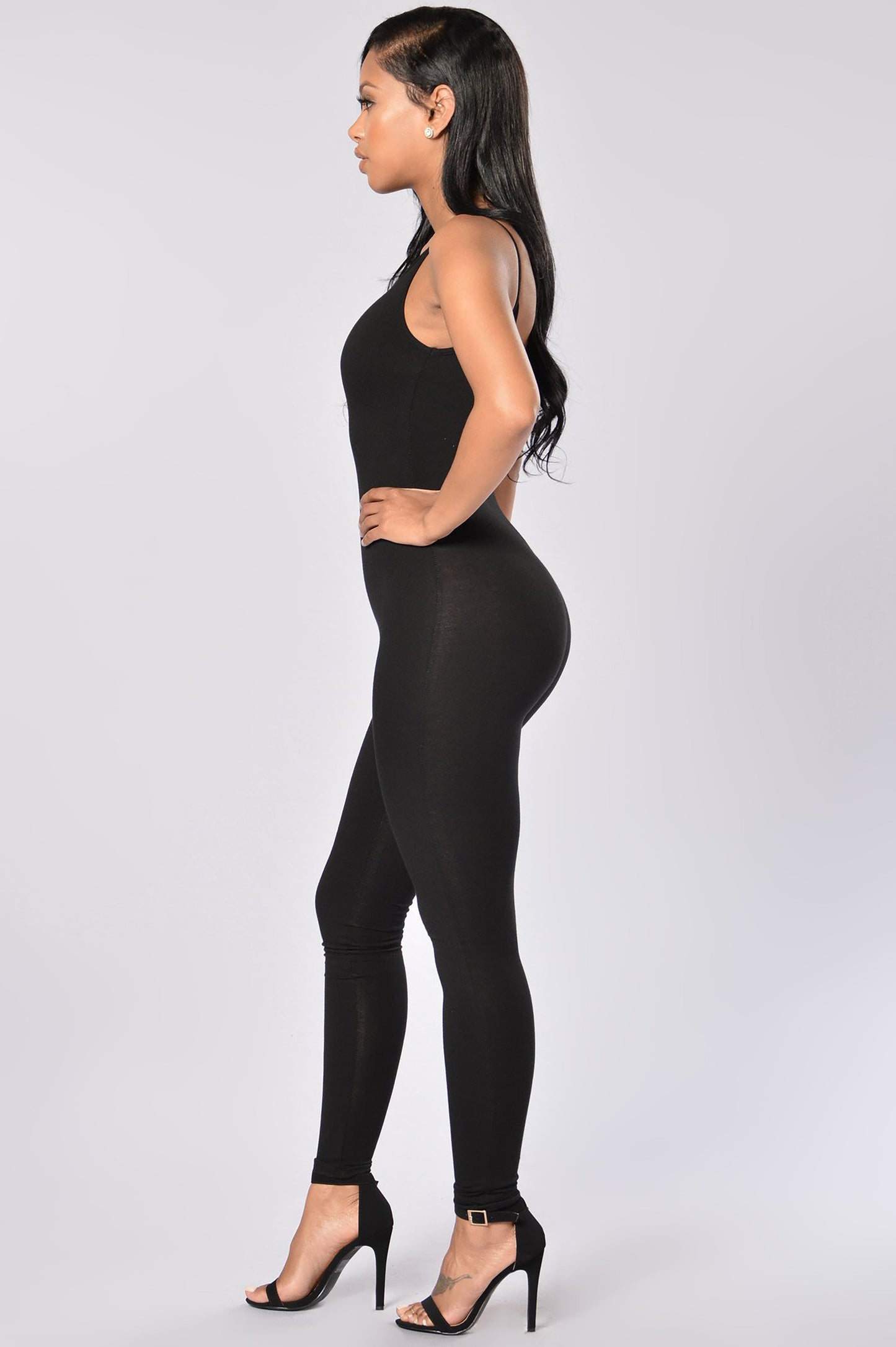 Fashion Nova black jumpsuit for women, form-fitting design with a sleek appearance and stylish silhouette