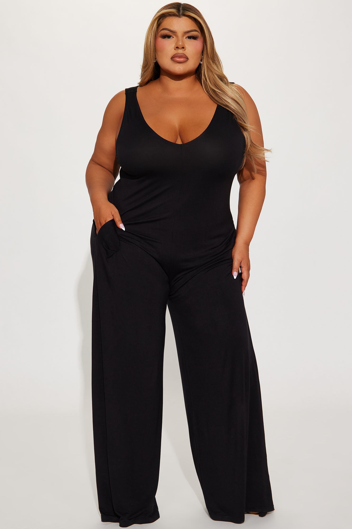 Fashion Nova black jumpsuit for women featuring a relaxed fit and pockets for added comfort