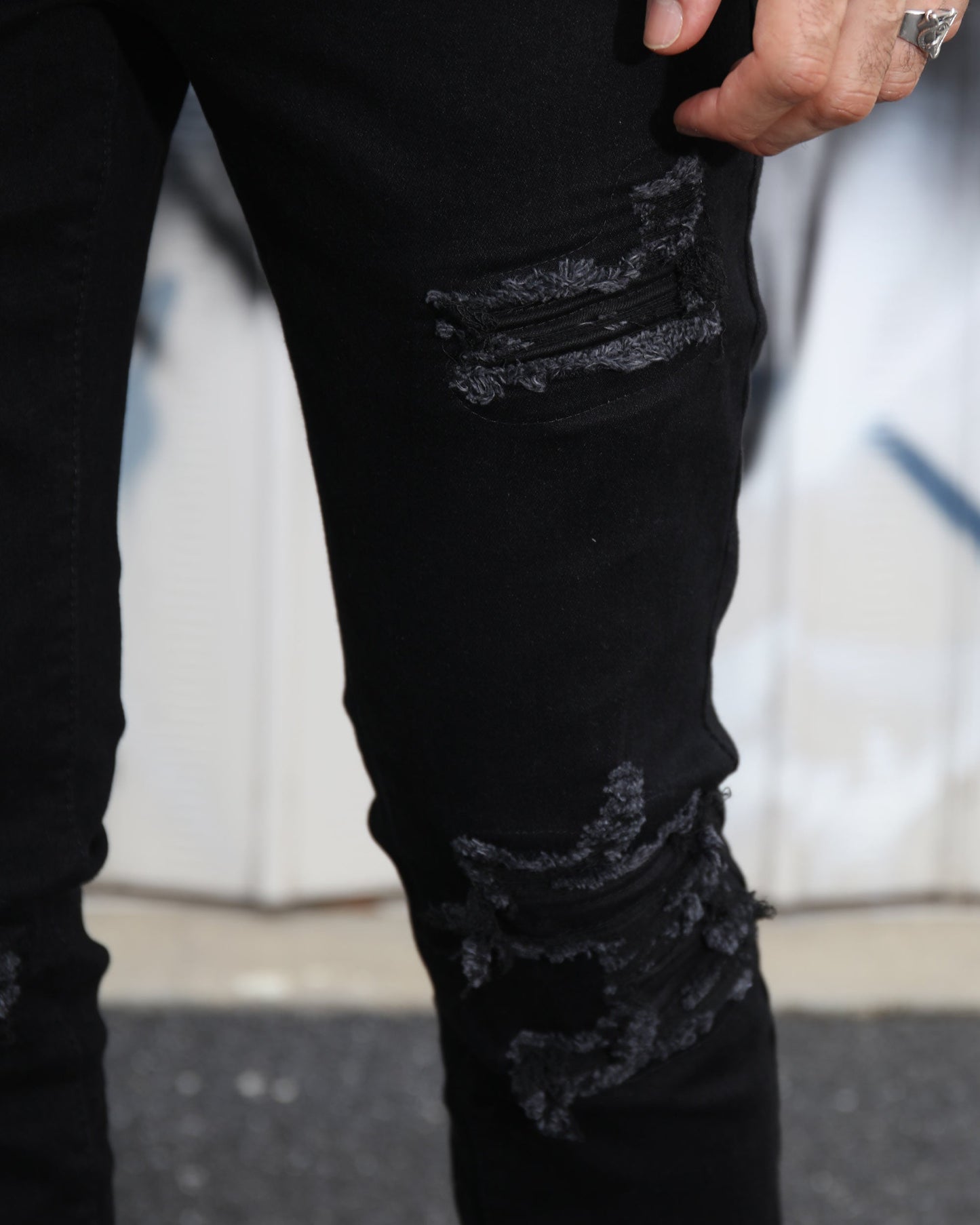Logeqi black ripped jeans for men featuring stylish distressed detailing and a modern fit