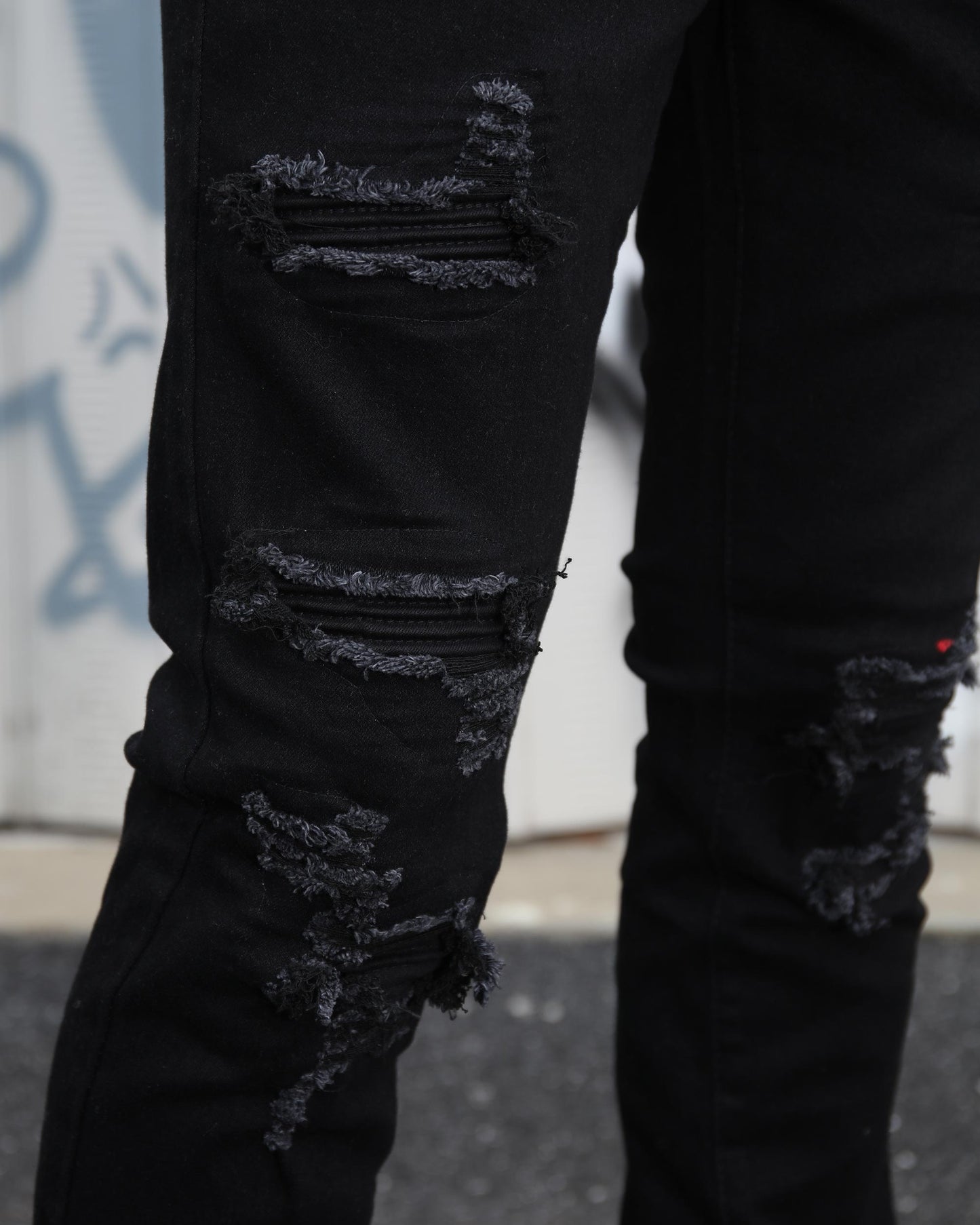 Logeqi black ripped jeans for men featuring distressed detailing and a modern fit