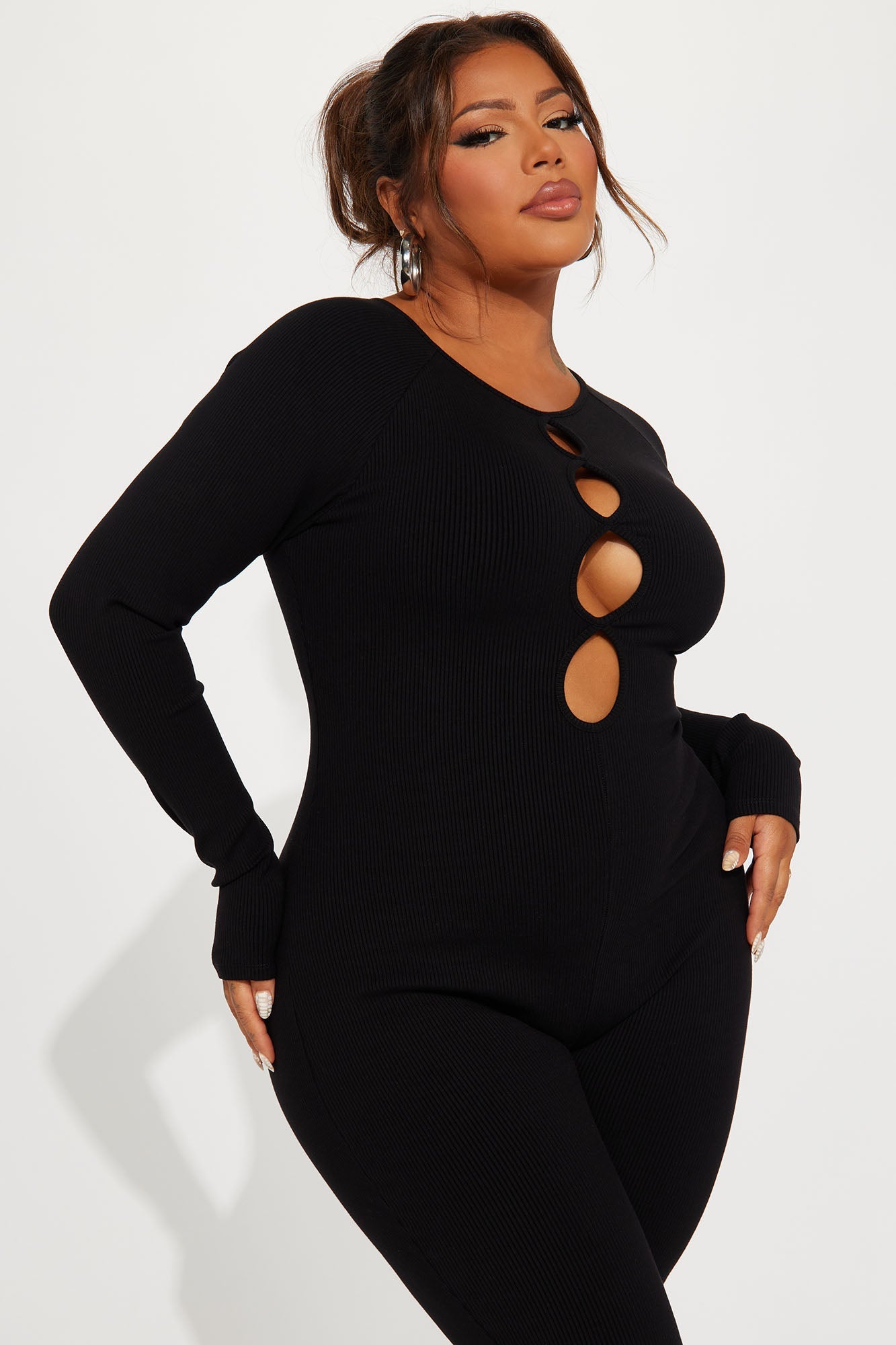 Fashion Nova black snatched jumpsuit featuring stylish cutouts and form-fitting design