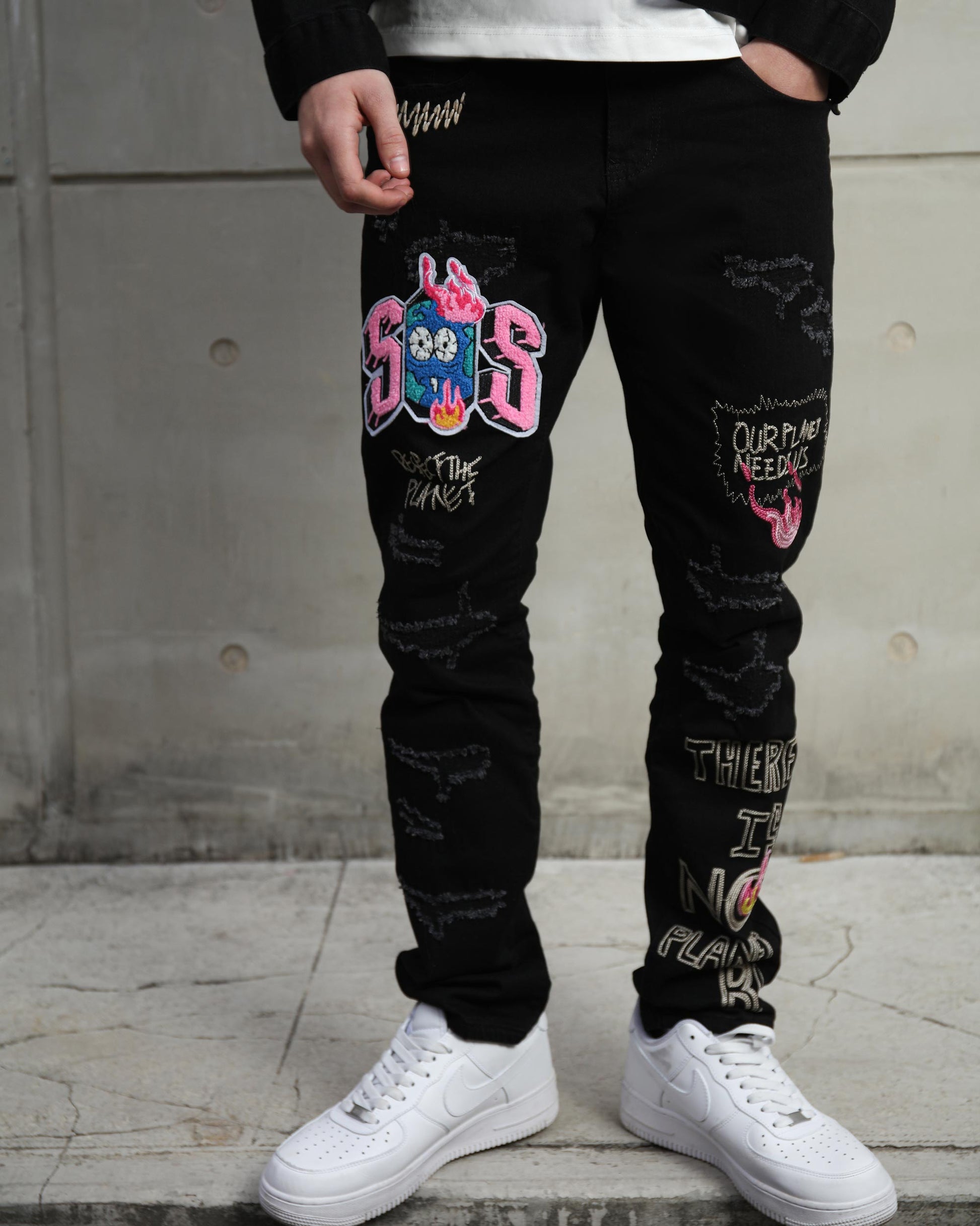 Logeqi black streetwear patchwork jeans featuring colorful graphic designs and a trendy fit