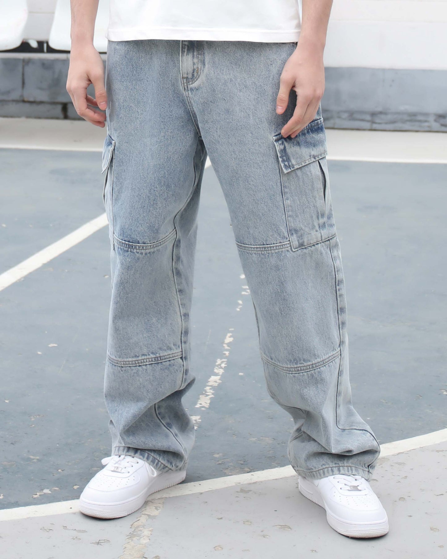 Logeqi blue cargo jeans for men with multiple pockets and relaxed fit styled with white sneakers
