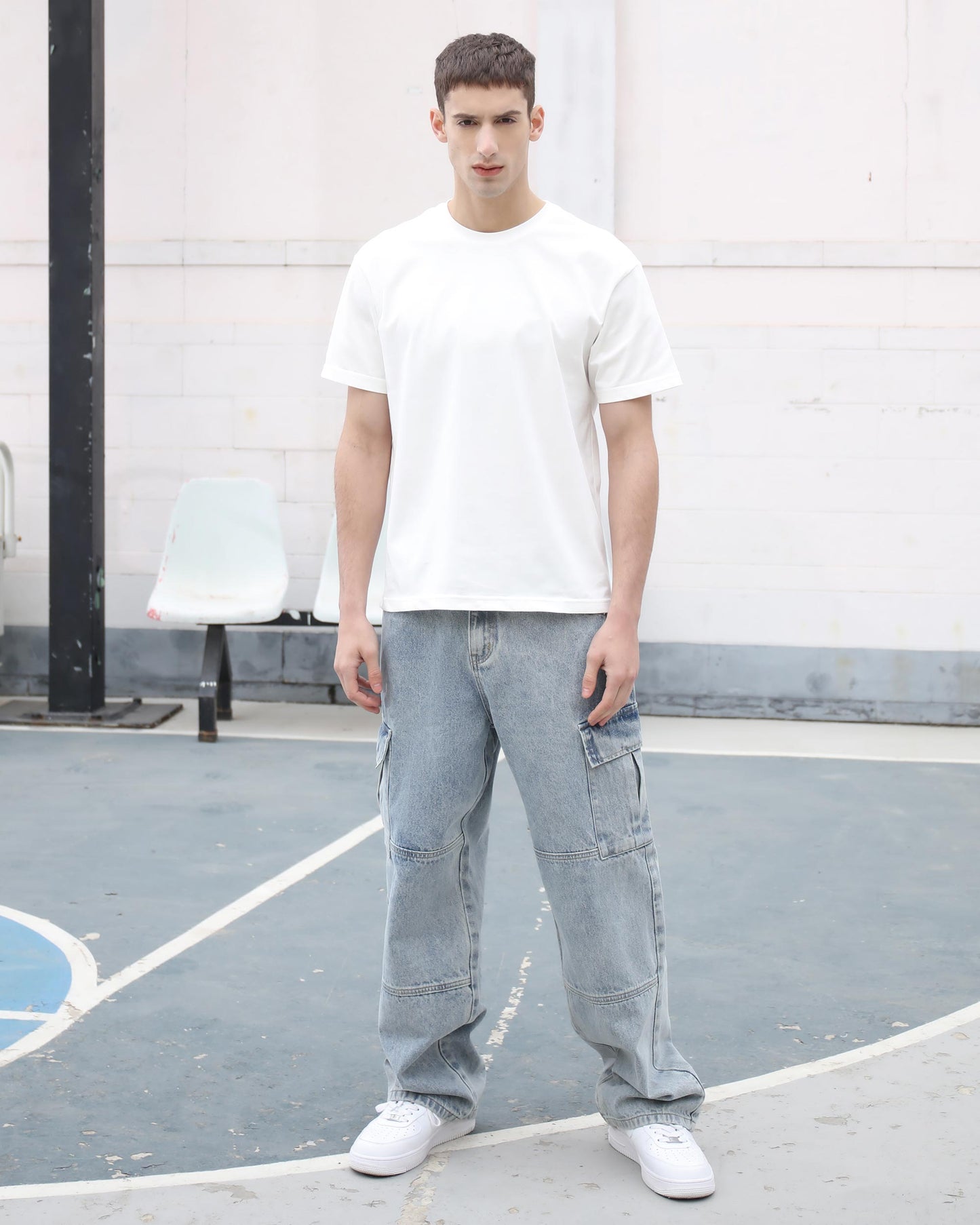 Logeqi blue cargo jeans for men styled with a plain white t-shirt and white sneakers