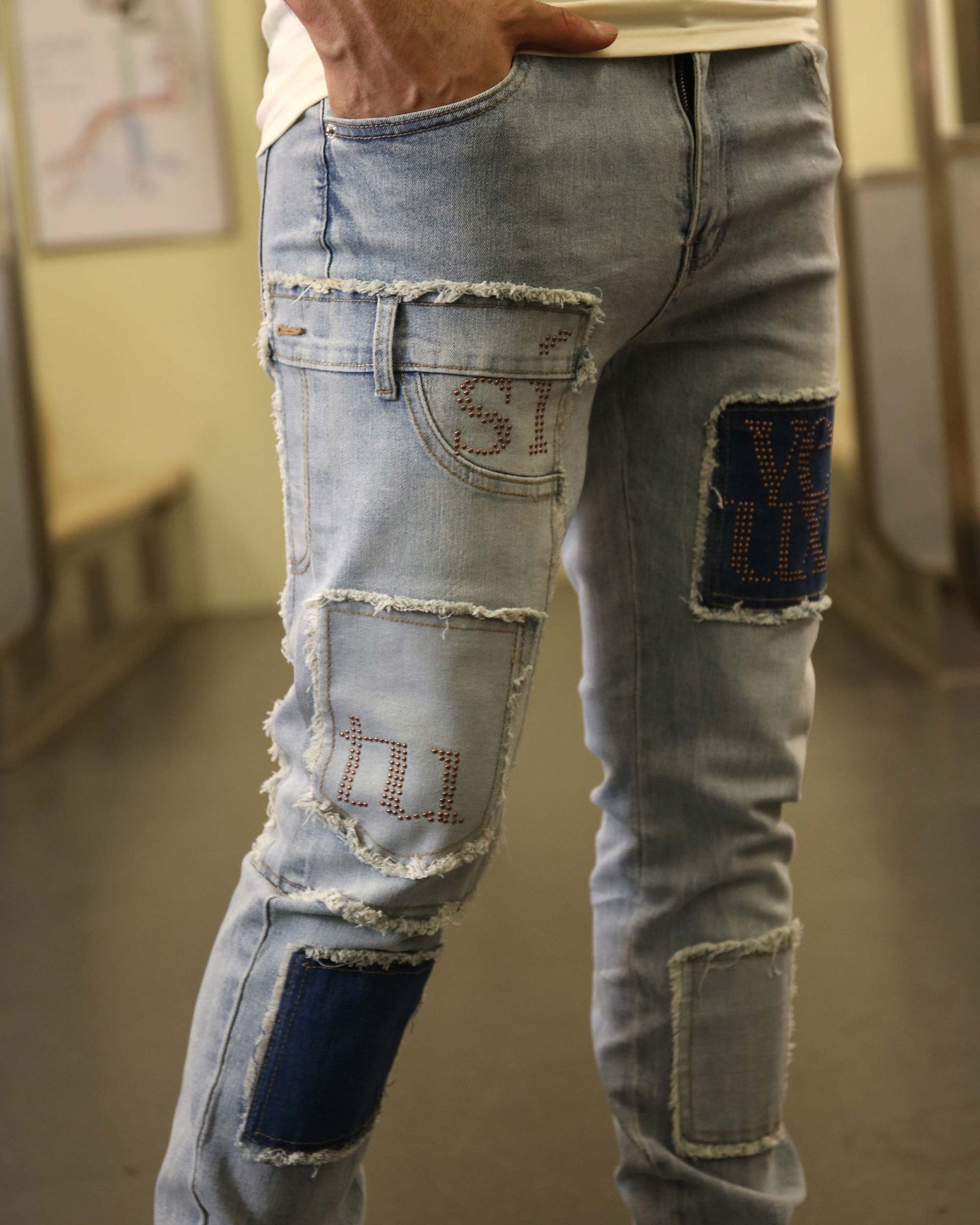 Logeqi blue jeans with diamond accents featuring distressed patches and decorative stitching