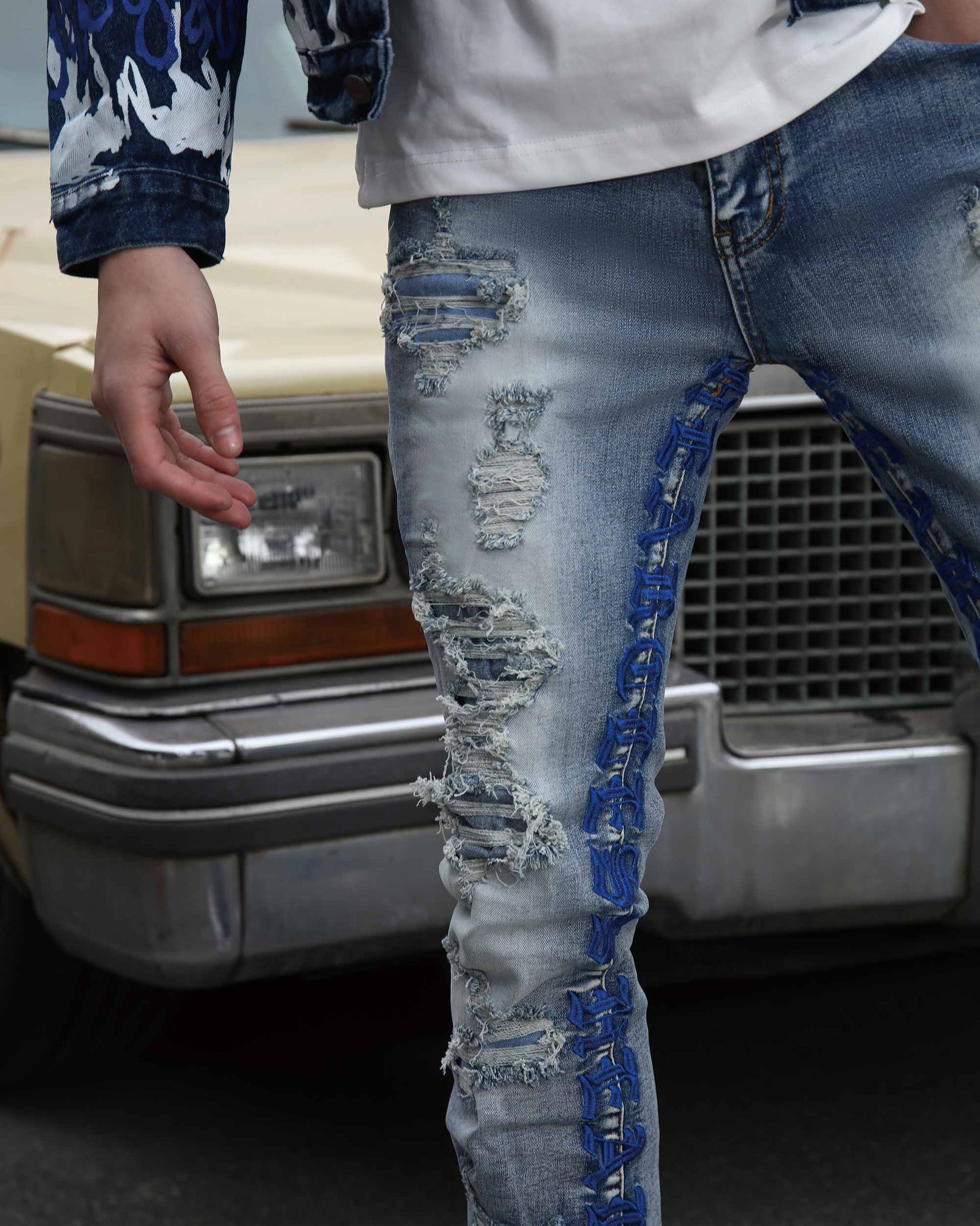 Logeqi blue retro flared jeans with distressed detailing and unique embellishments