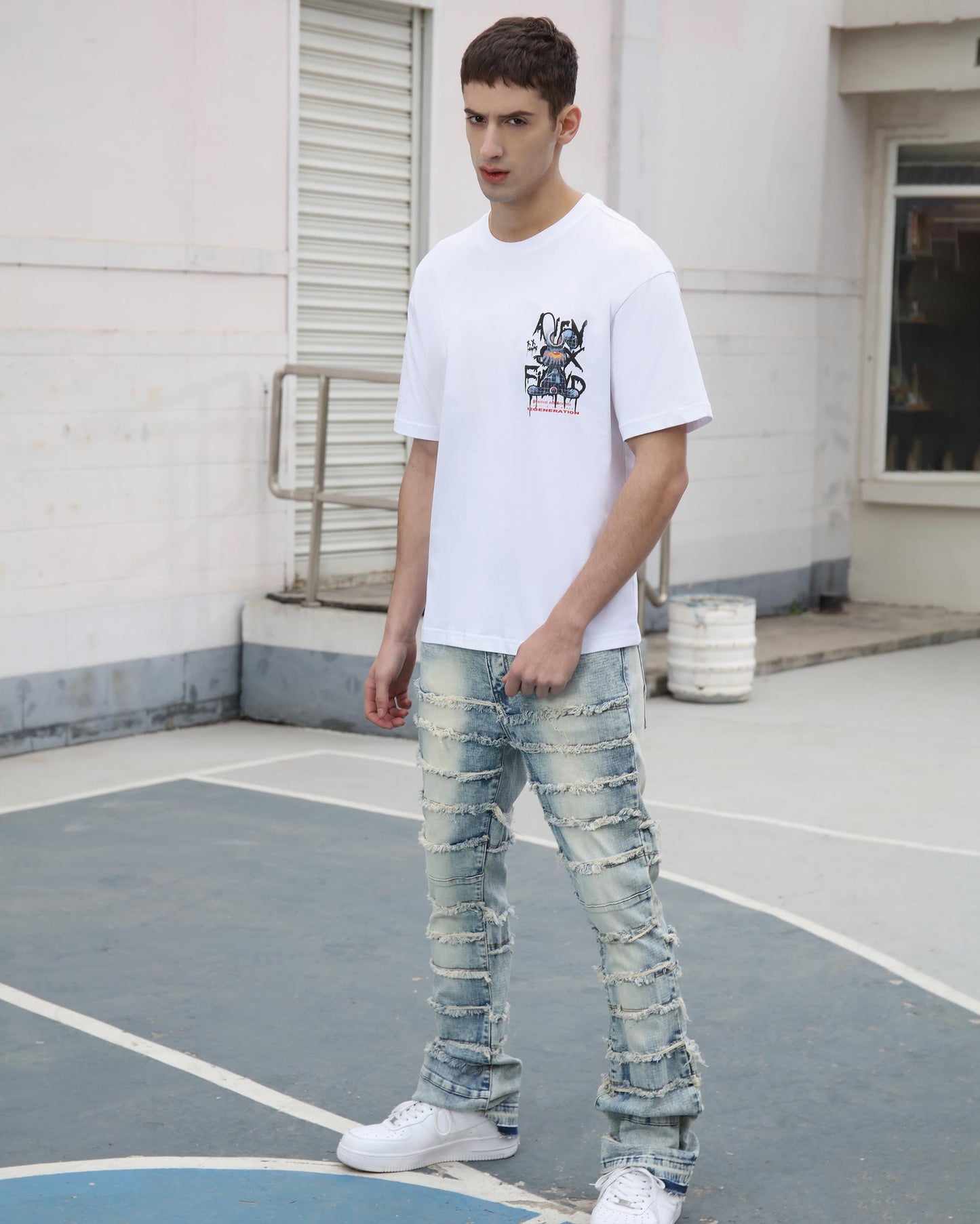 Logeqi blue retro flared jeans with distressed details and a casual fit on a model outdoors