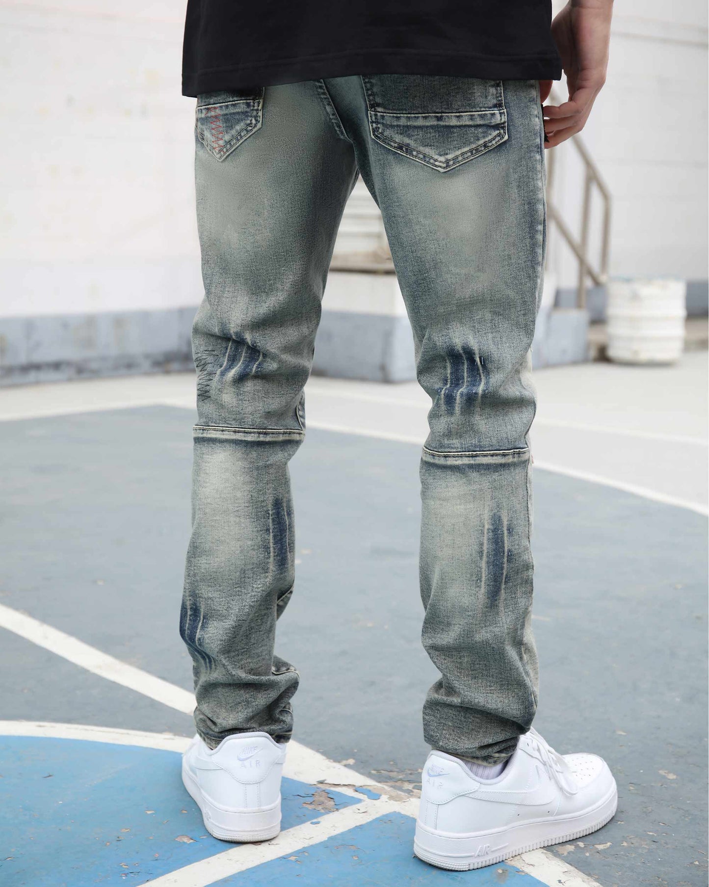 Logeqi blue ripped jeans with skull print featuring a slim fit and distressed design for a trendy look