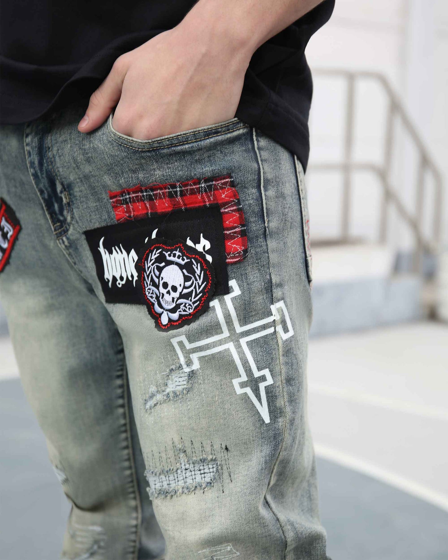 Logeqi blue ripped jeans with skull print featuring patchwork and distressed details