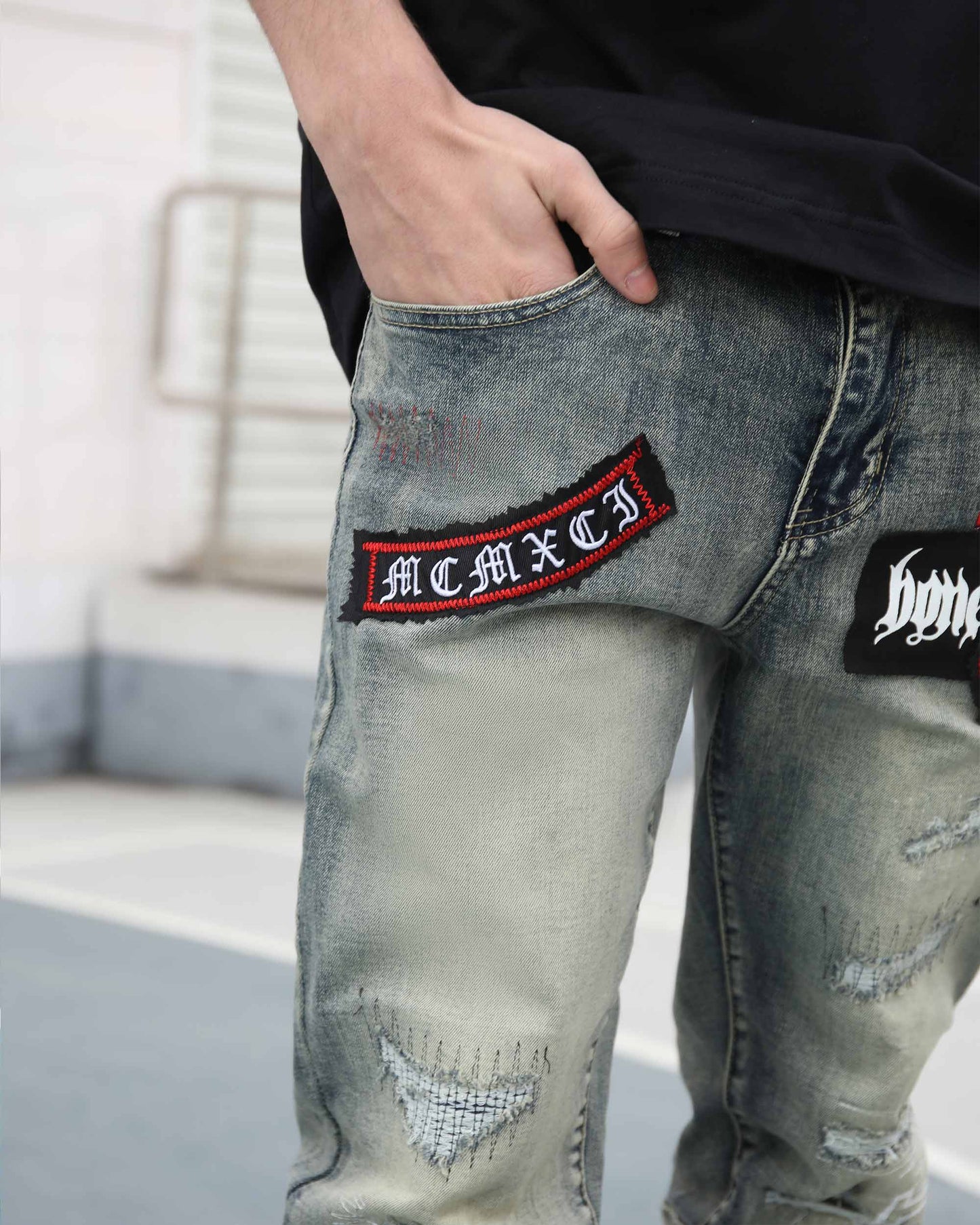 Logeqi blue ripped jeans with skull print featuring stylish patches on the pockets