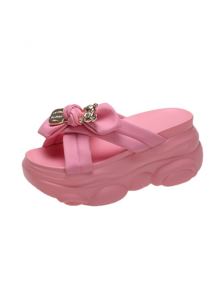 Pink bow platform slippers for women with thick cushioned sole and decorative bow detail