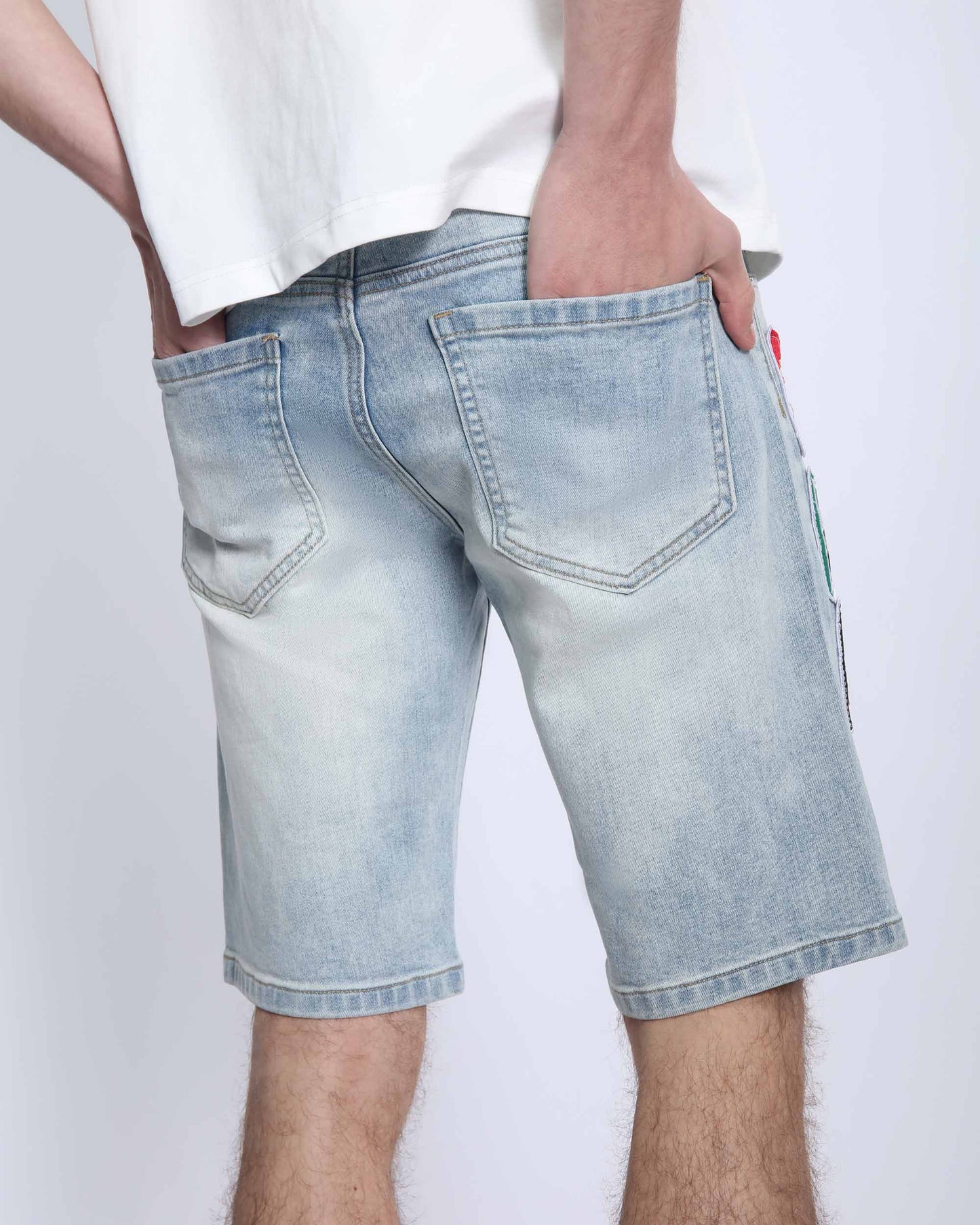 Men wearing Logeqi light wash denim shorts with back pockets and casual fit
