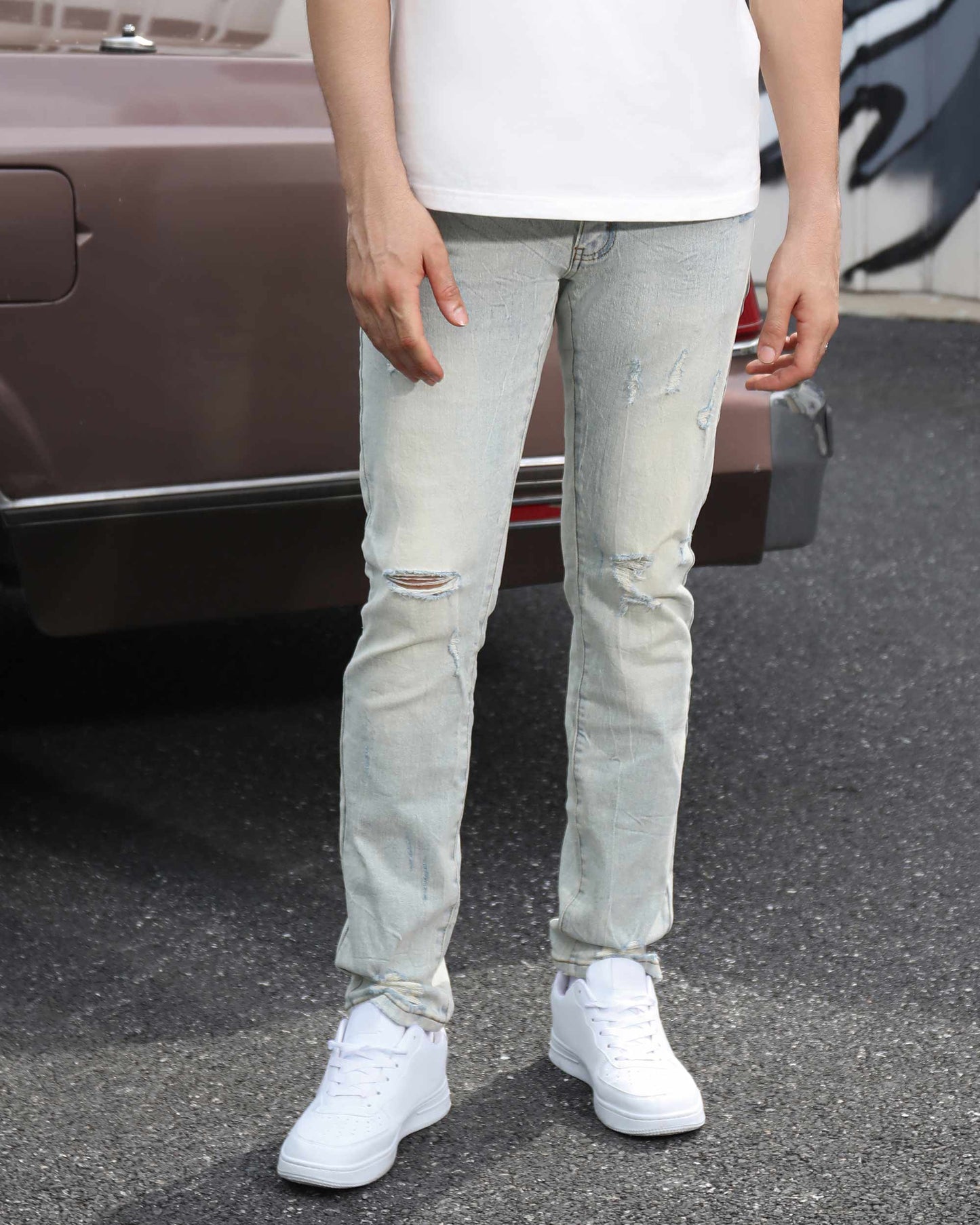 Logeqi straight fit ripped jeans with distressed detailing and a light wash for a casual style