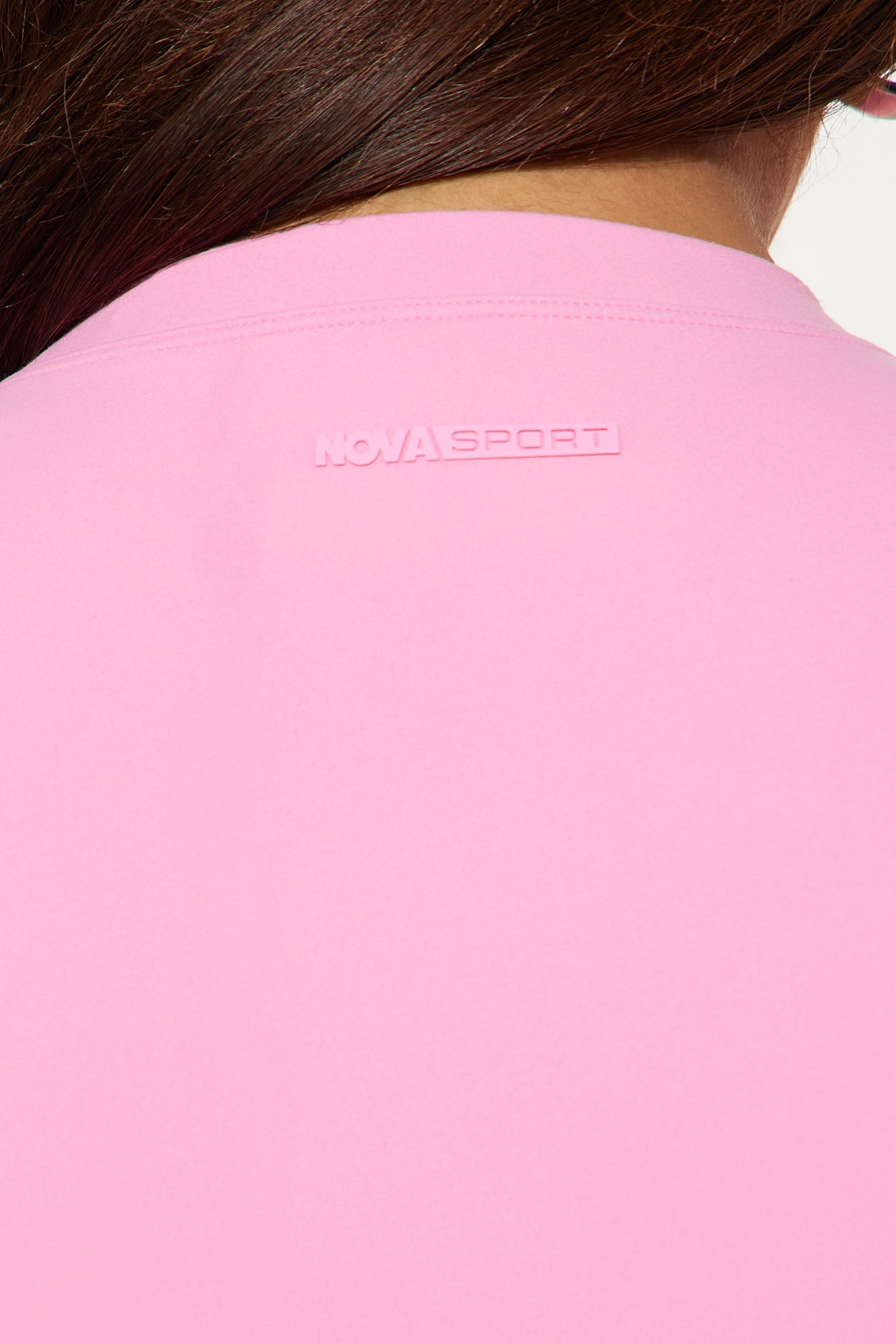 Nova Sport bubblegum pink crop top with logo detail on the back for stylish activewear