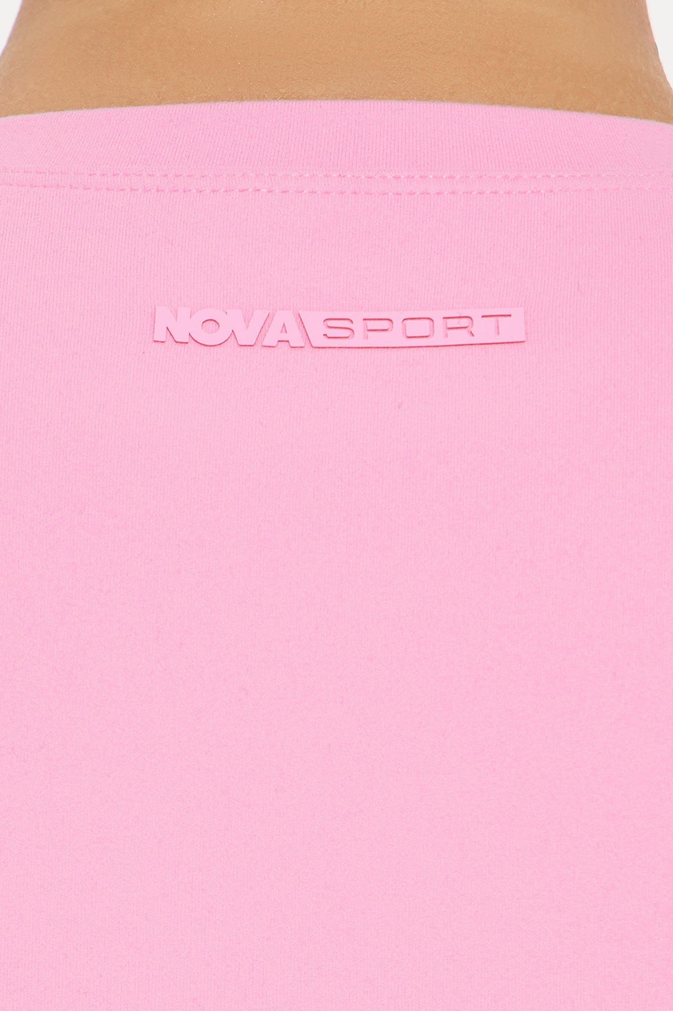 Fashion Nova Nova Sport bubblegum pink crop top featuring a stylish logo on the back