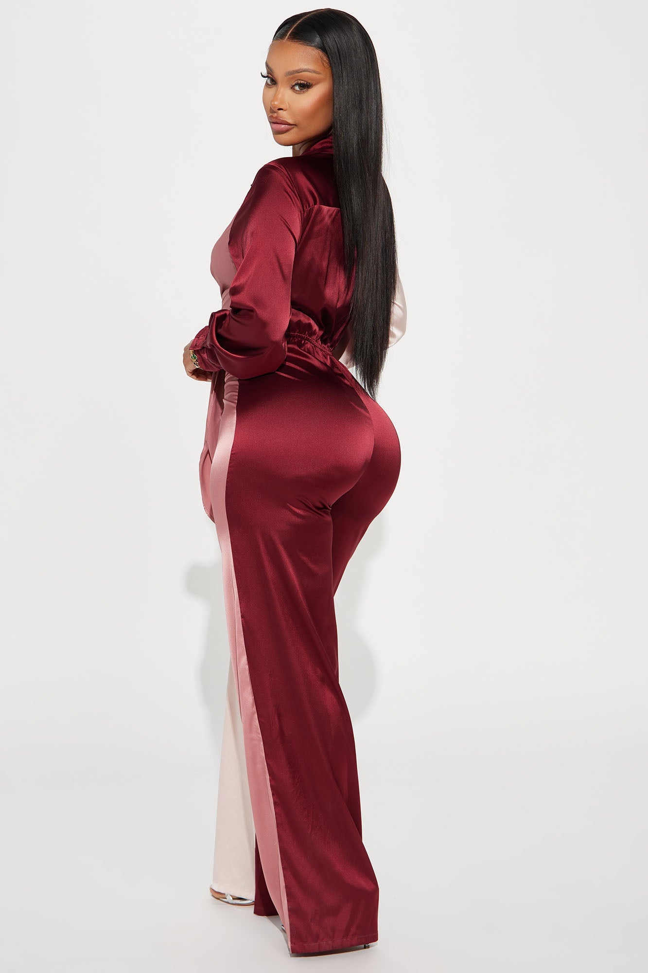 Stylish burdundy satin jumpsuit for women featuring a sleek design and fitted silhouette
