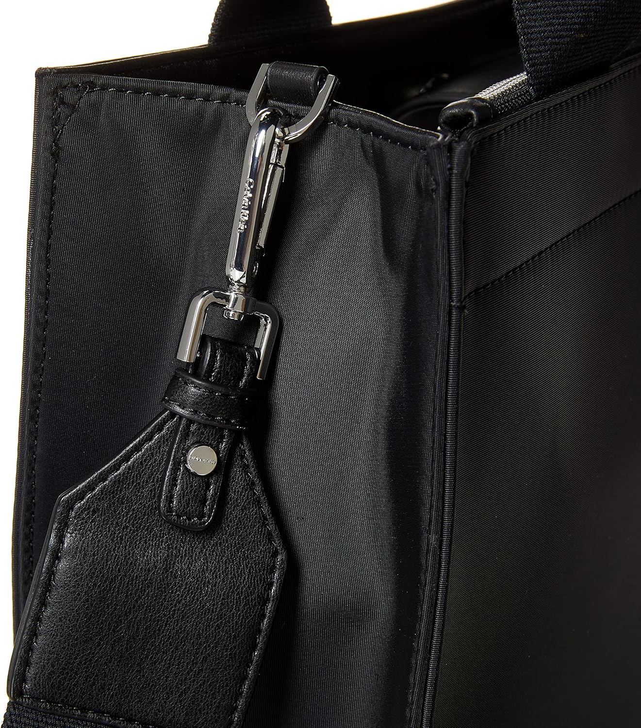 Close-up of a Calvin Klein crossbody bag for women featuring a sleek black design and stylish hardware