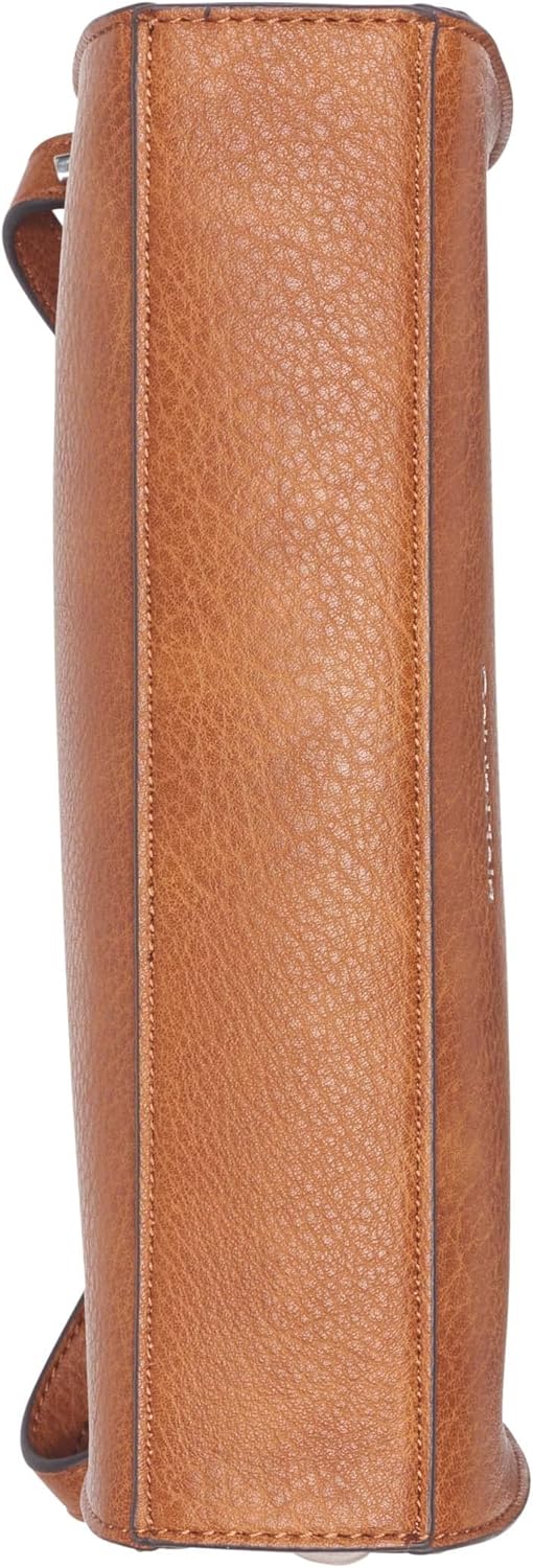 Side view of Calvin Klein Reyna crossbody bag in rich brown leather with sleek design