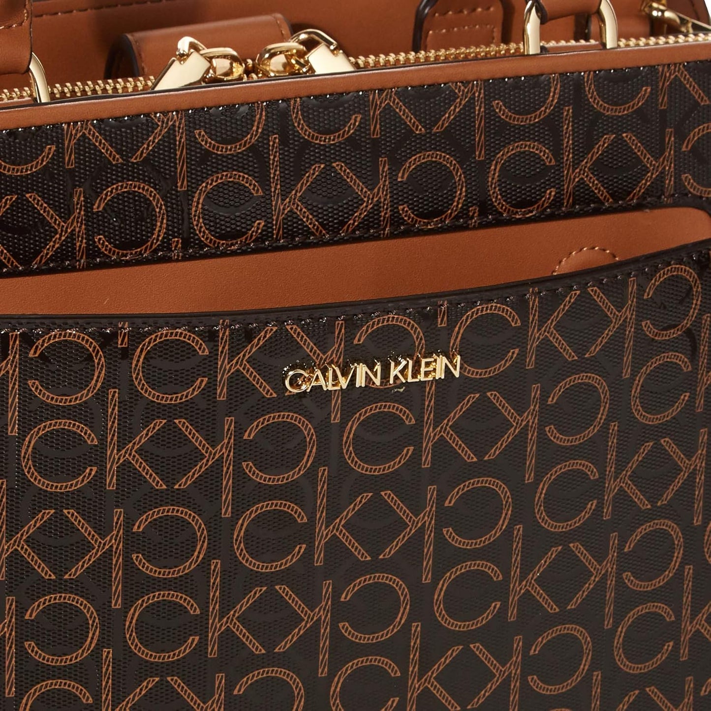 Calvin Klein textured satchel bag with signature logo pattern and spacious interior for stylish storage