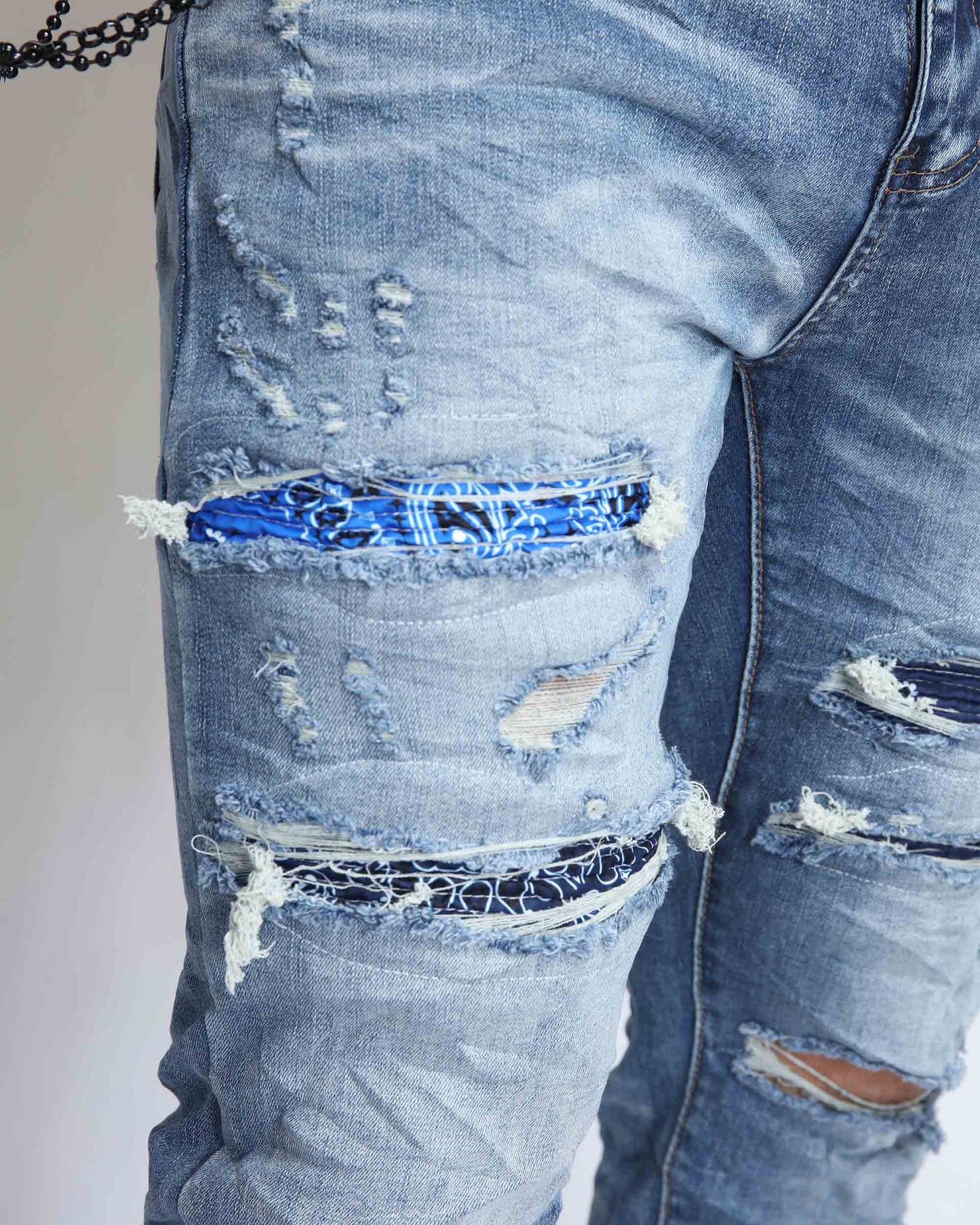 Logeqi Cashew Blossom patched jeans with distressed detailing and colorful fabric patches