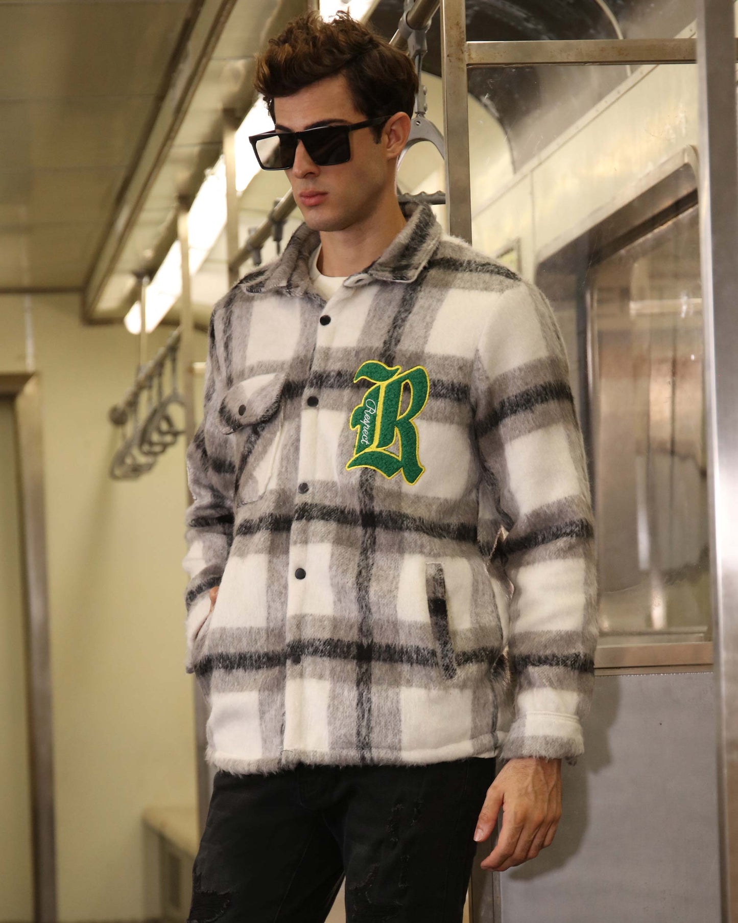 Logeqi classic plaid moto jacket in white and gray worn by man with sunglasses in subway