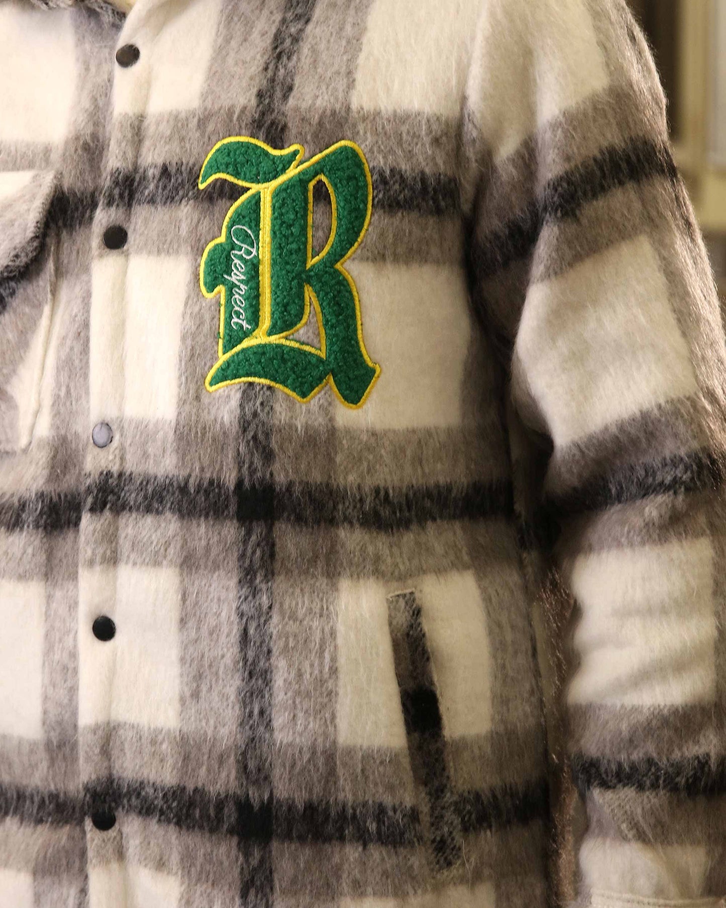 Logeqi classic plaid moto jacket with black and white check pattern and embroidered green R patch