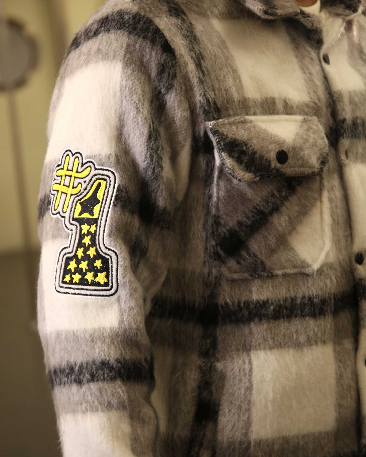 Logeqi classic plaid moto jacket with black and white checkered pattern and #1 patch on sleeve