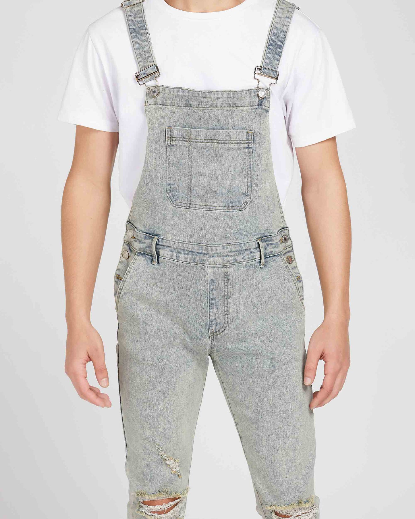 Logeqi classic ripped overalls in light gray denim worn over a white t-shirt