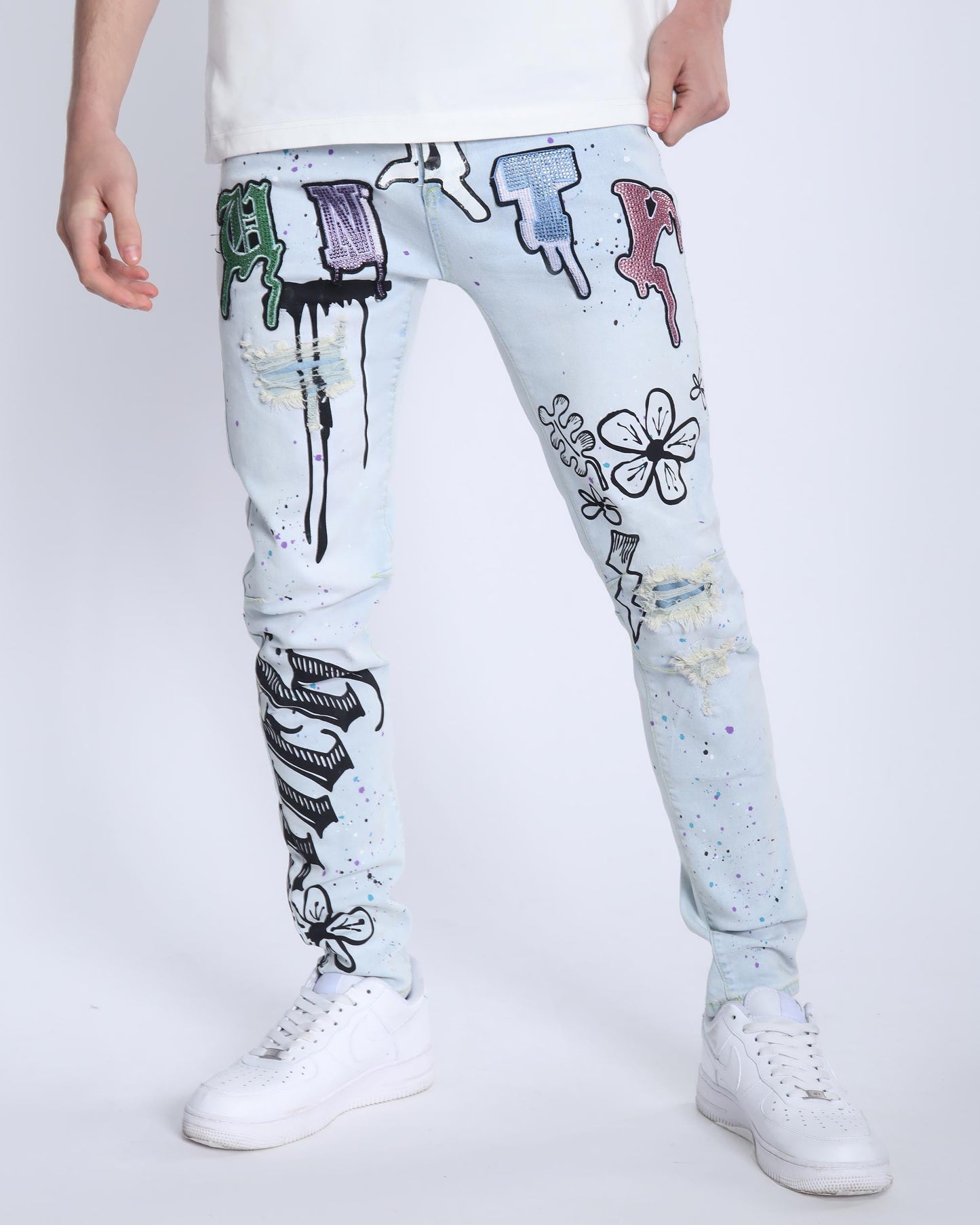 Logeqi comic painted ripped jeans in light blue with colorful graffiti art and distressed details