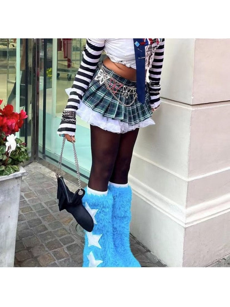 Wholesale7 contrast color snow boots in bright blue with white stars worn with black tights and plaid skirt