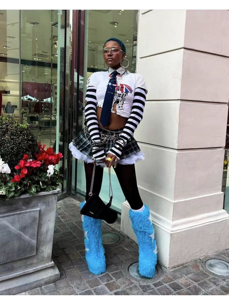 Wholesale7 contrast color snow boots in bright blue fuzzy design worn with black tights and plaid skirt