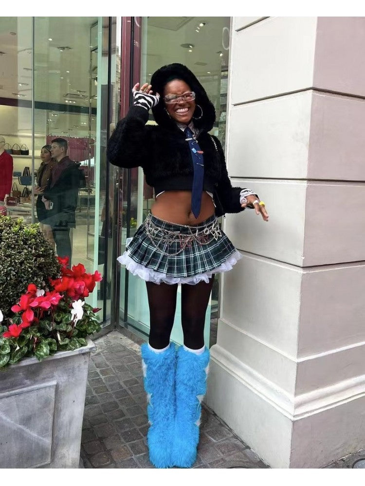 Wholesale7 contrast color snow boots in bright blue worn with black tights and a plaid skirt